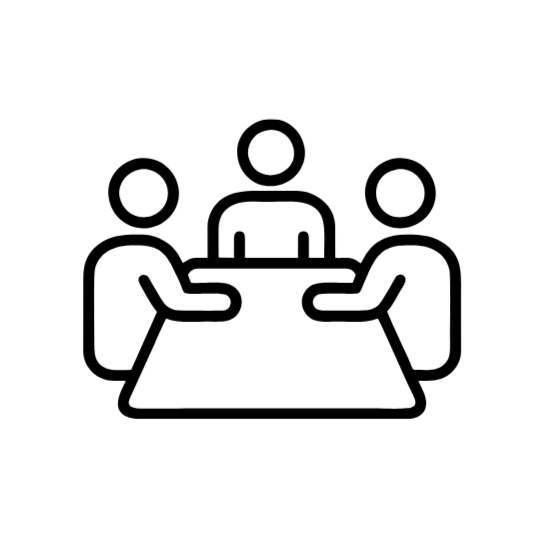 Icon of three people sitting at a table, representing a meeting or discussion.