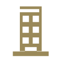 A tall beige building with multiple windows