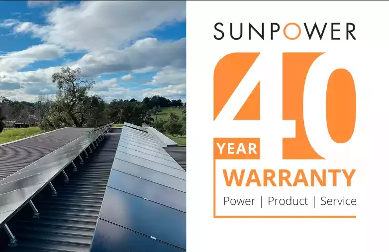 A rooftop with solar panels under a partly cloudy sky on the left side, and a promotional graphic for SunPower highlighting a 40-year warranty on power, product, and service on the right side.