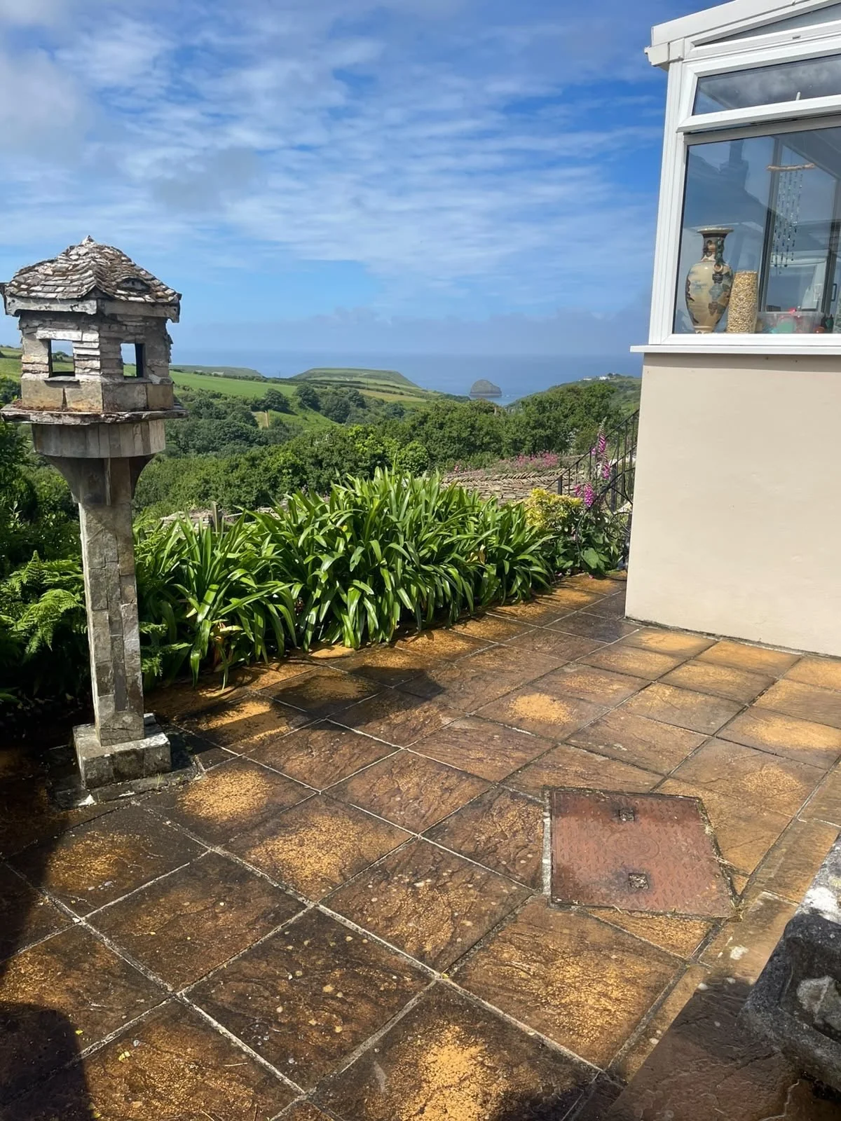 Patio paving before exterior cleaning at a Cornwall property