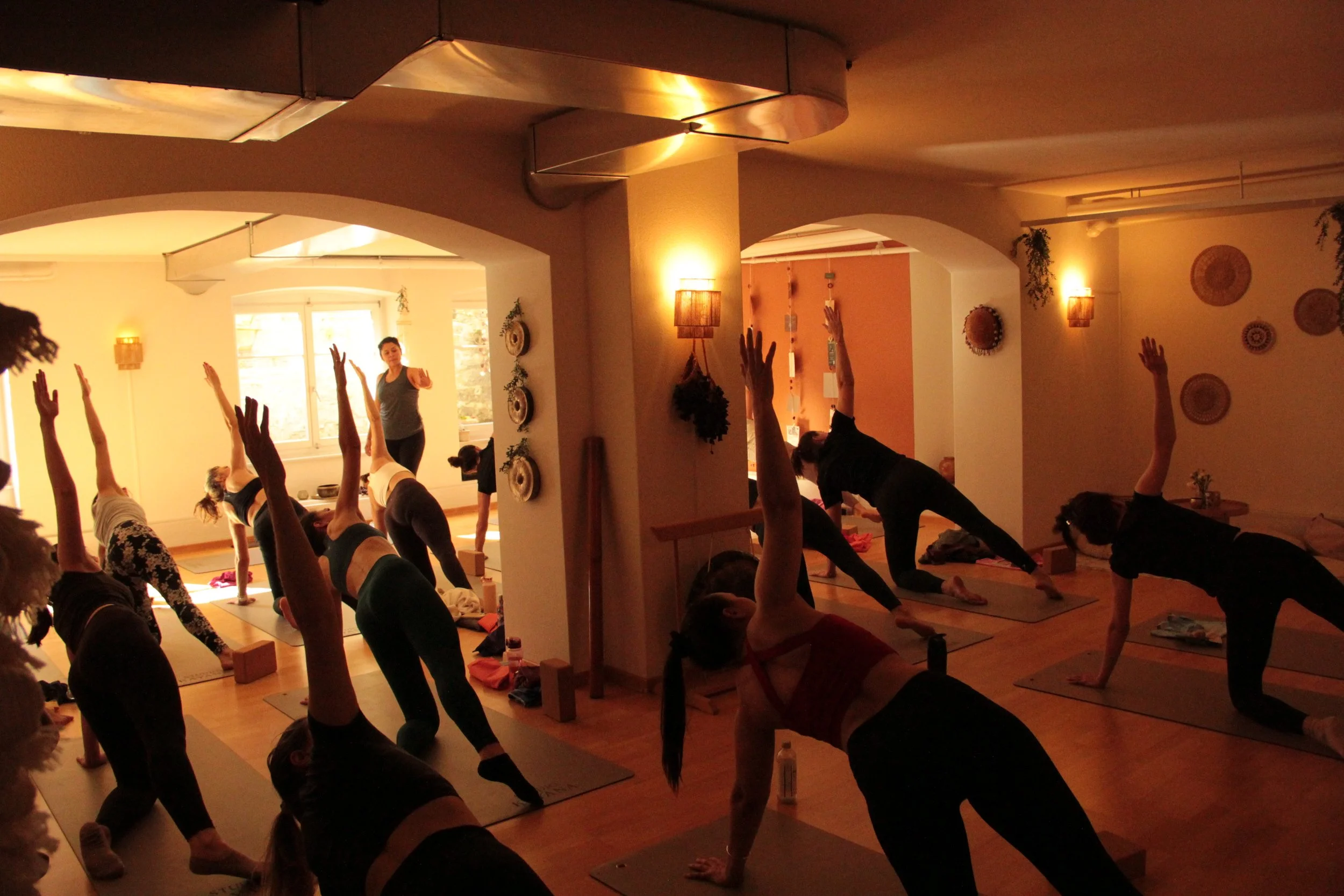 Yoga practice indoors during an Ice & Yoga event