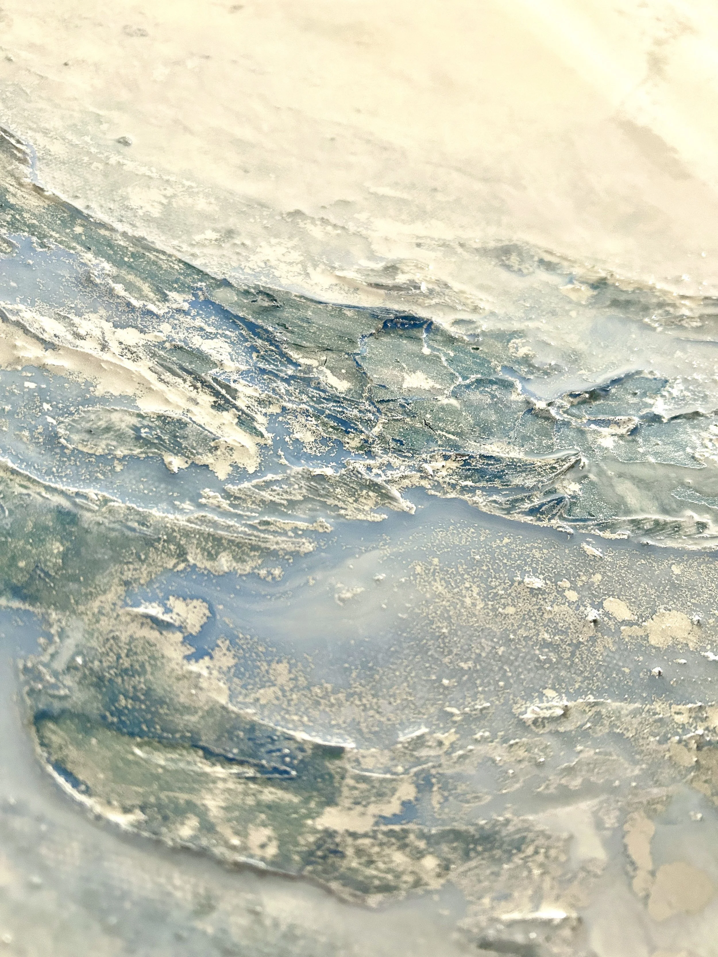Close-up of layered texture and metallic details in an abstract painting by Larissa Maddy