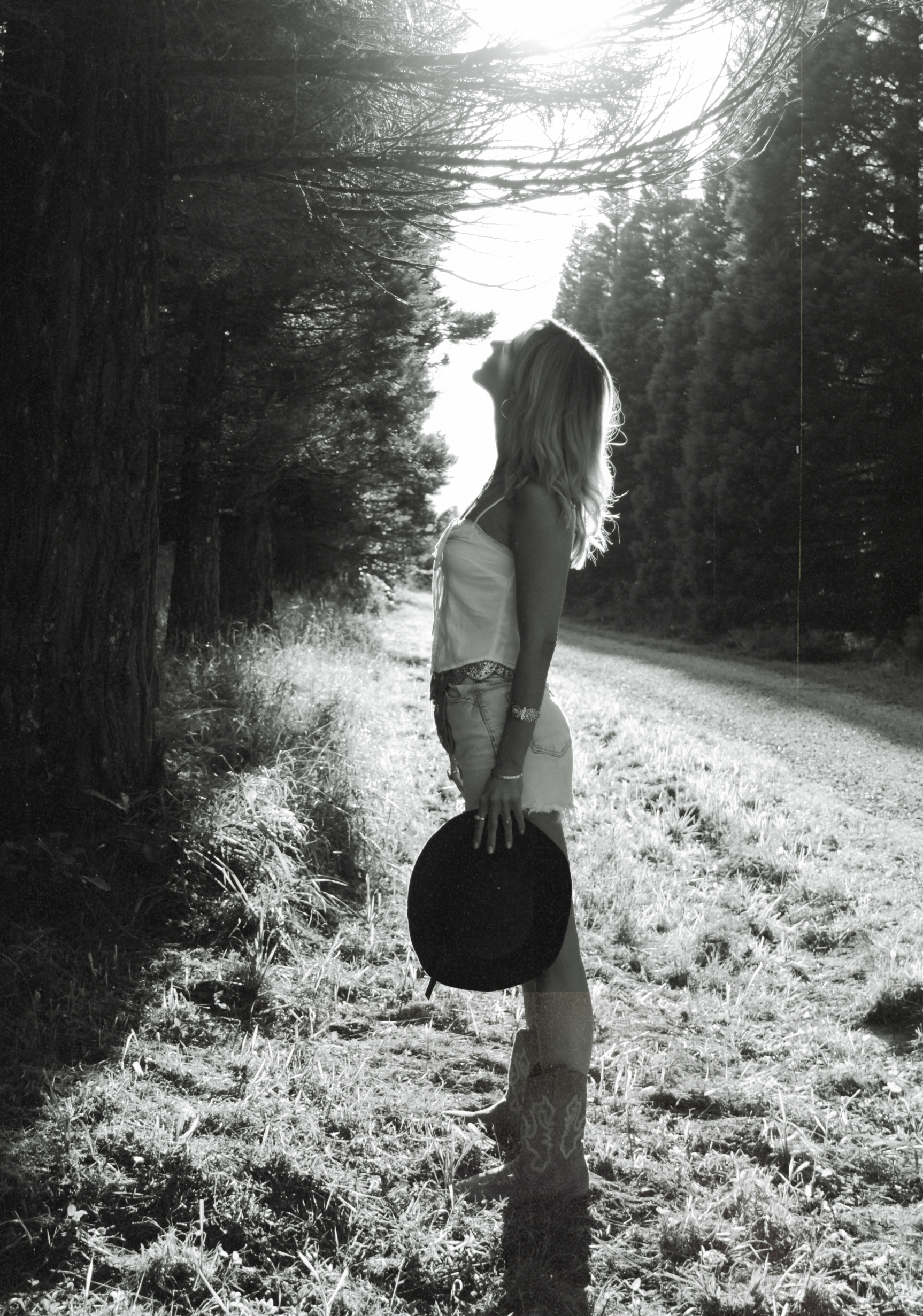 Black and white portrait of a woman in the forest