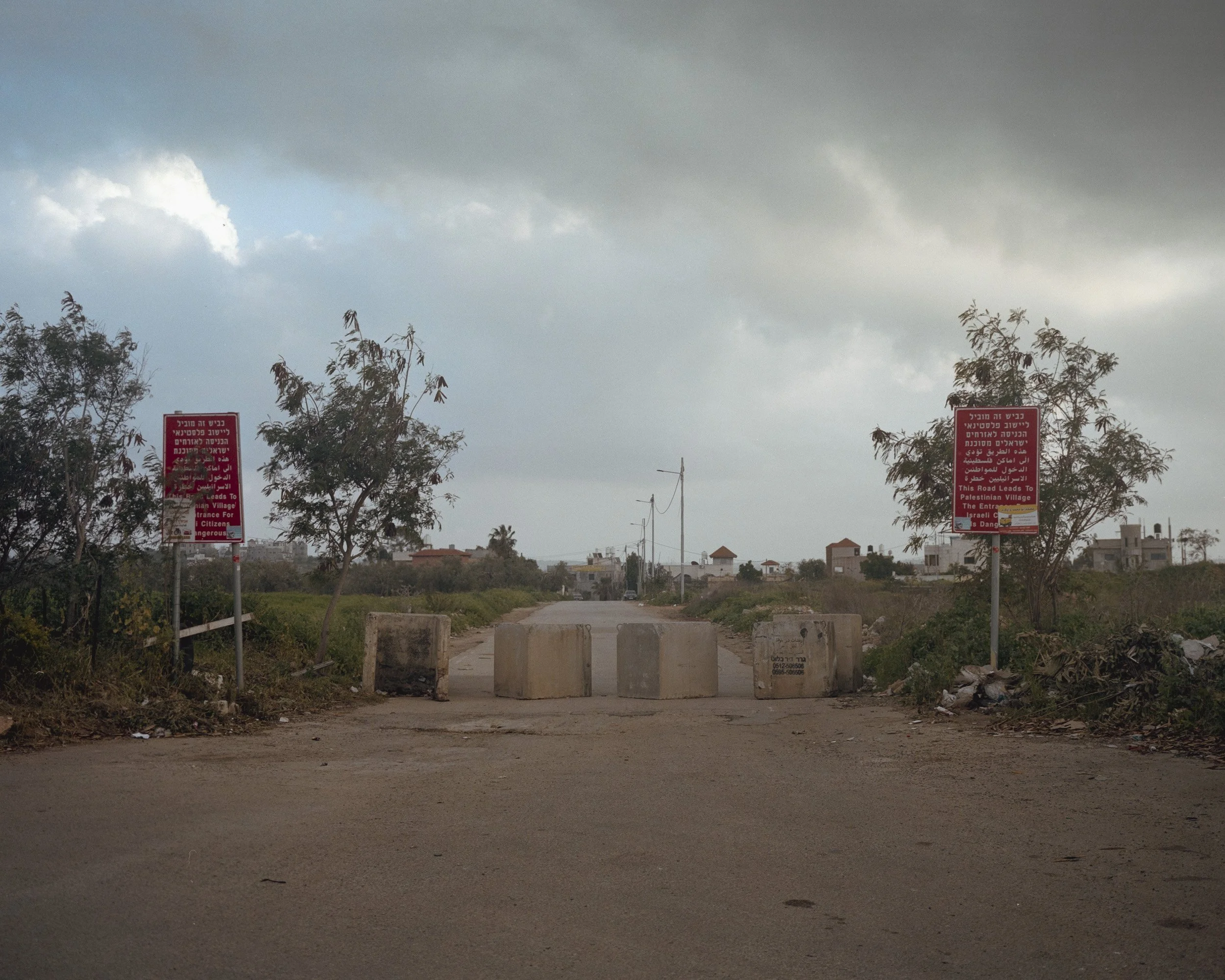 Entrance road to the Palestinian village of Rantis, from Route 465, used by Palestinians and Israelis in the West Bank. The road has been cut off by the Israeli military following October 7 2023.