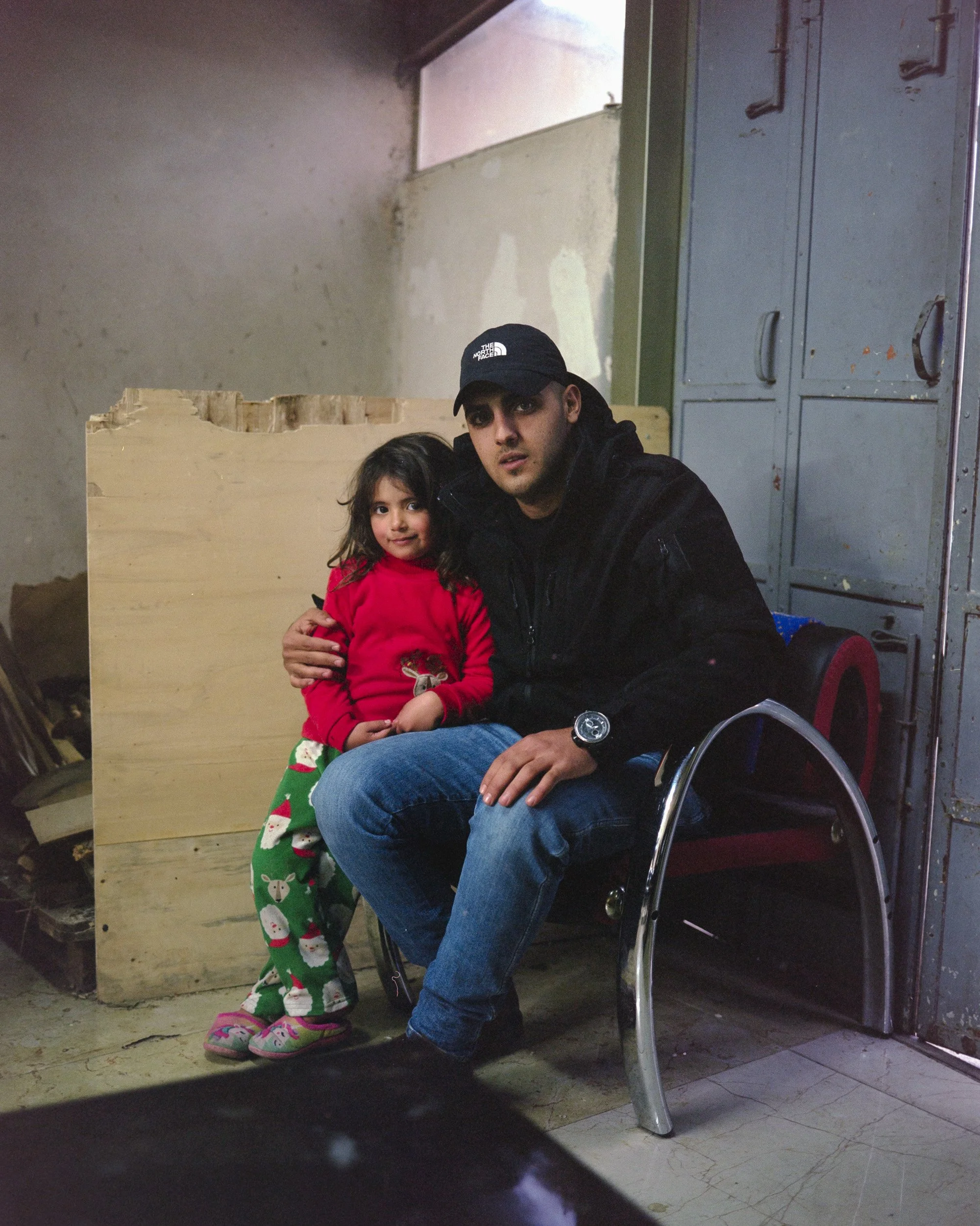 Ehab, a firefighter in Ramallah, with his sister Mariam. The Madani family lives at the foot of the Israeli colony of Beit El, next to Ramallah.