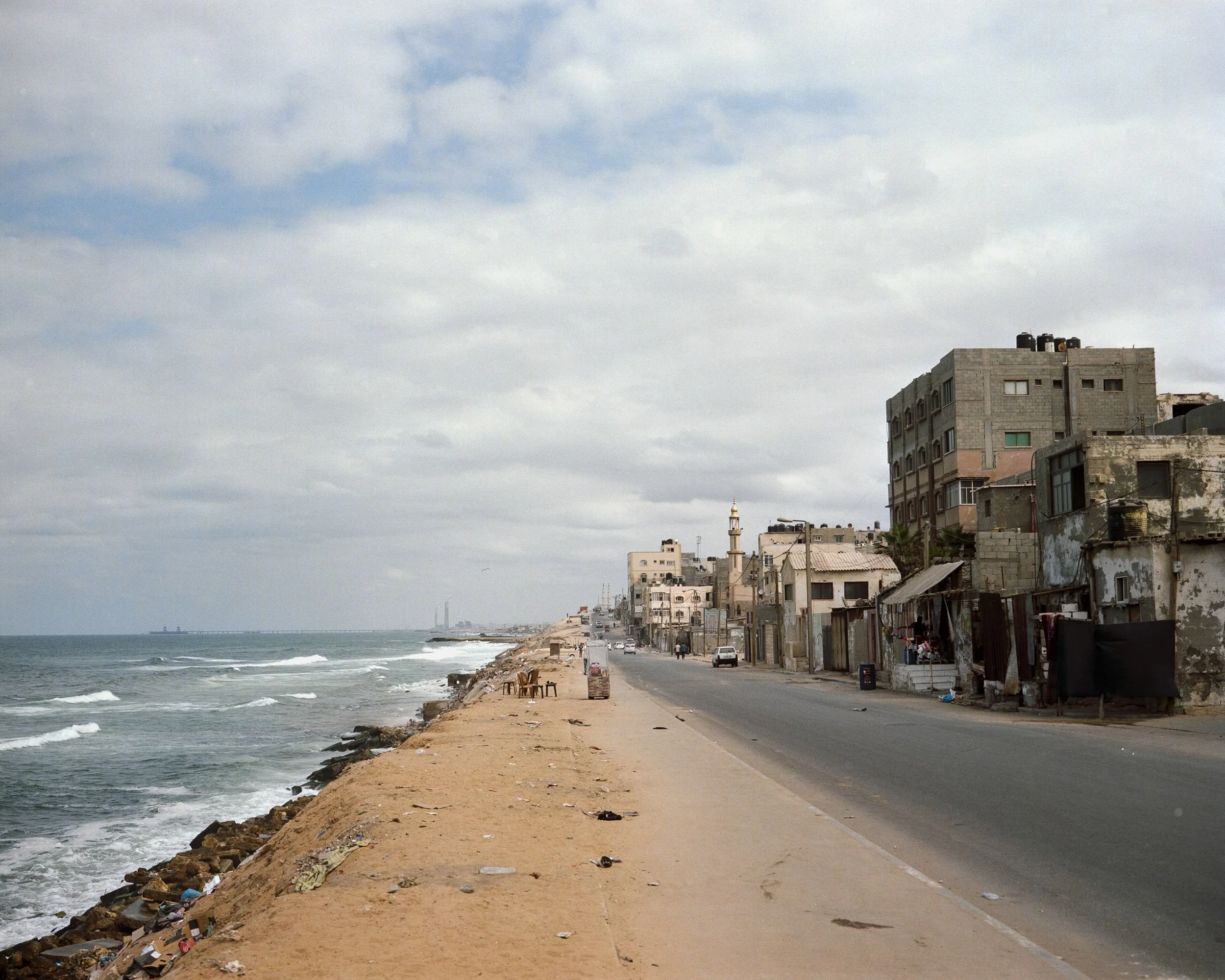 Shati refugee camp, Gaza, October 7, 2022. Visible in the background are factories located in Ashkelon, Israel. © Lucien Lung / Riva-Press