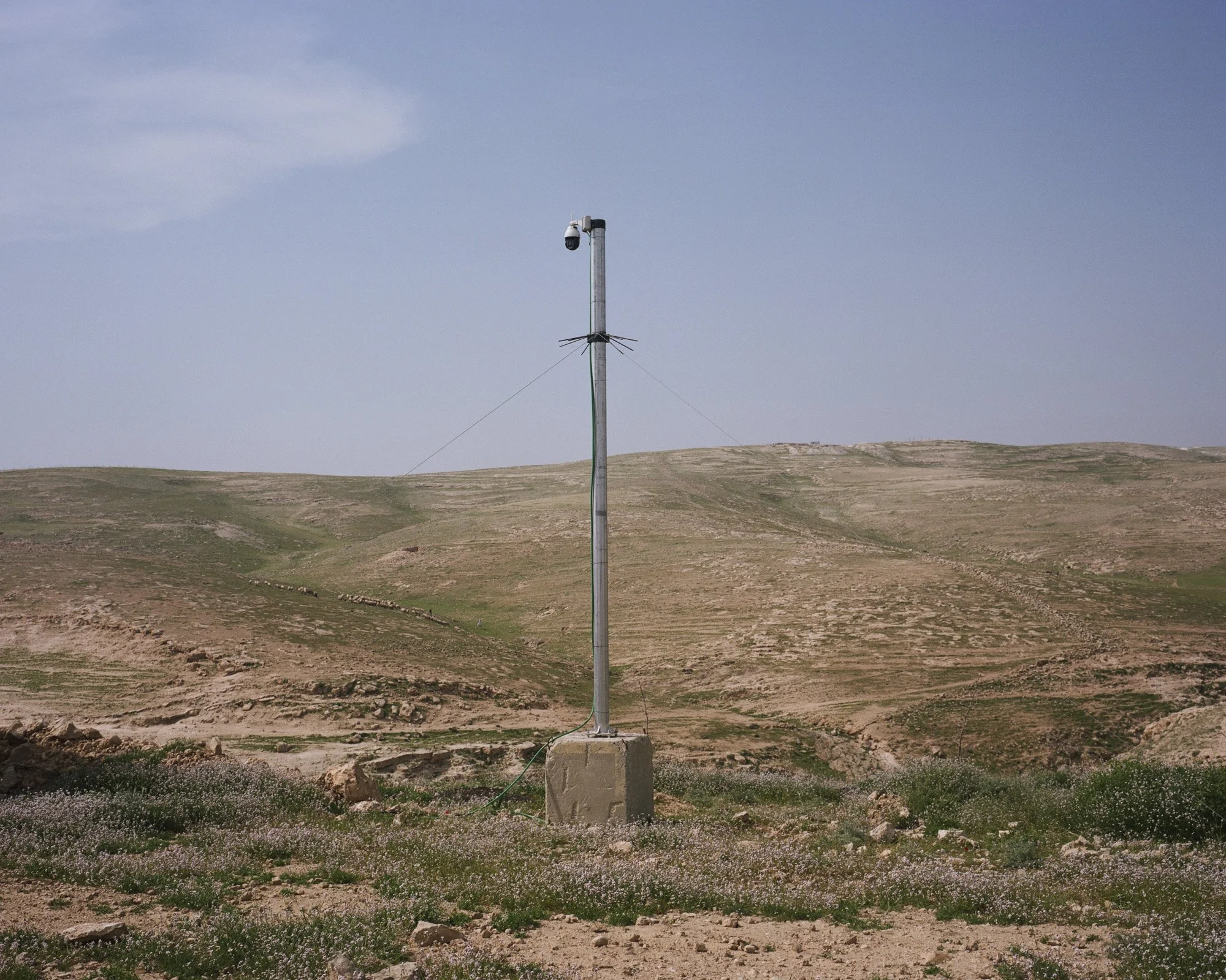 A camera films the surroundings of Kedar outpost settlement.