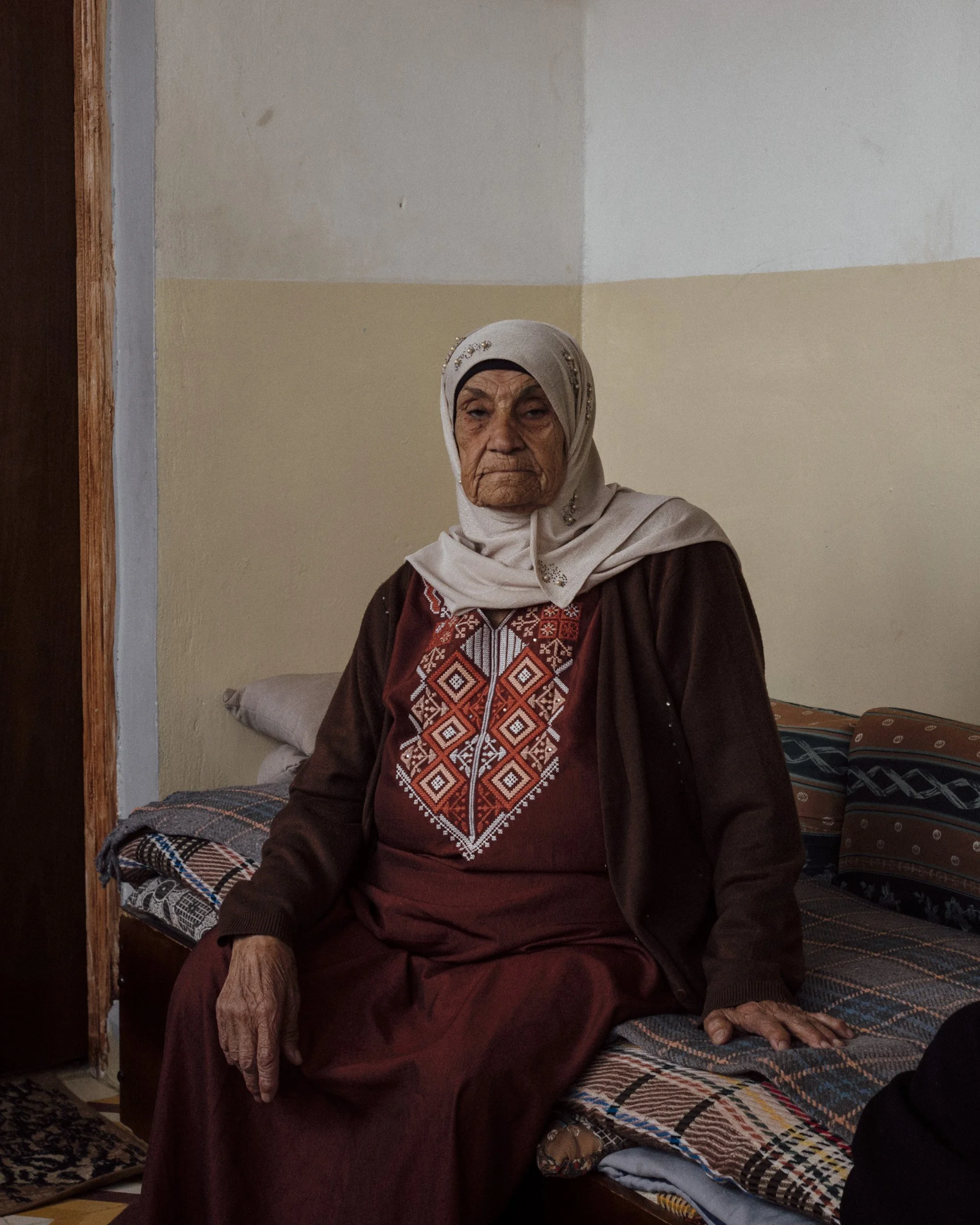 Hafiza (Oum Jaber), 81, at her home in Qaryut, West Bank.  As she went to tend to her fields near the village, Hafiza was threatened by settlers living nearby and forced to leave her crops.