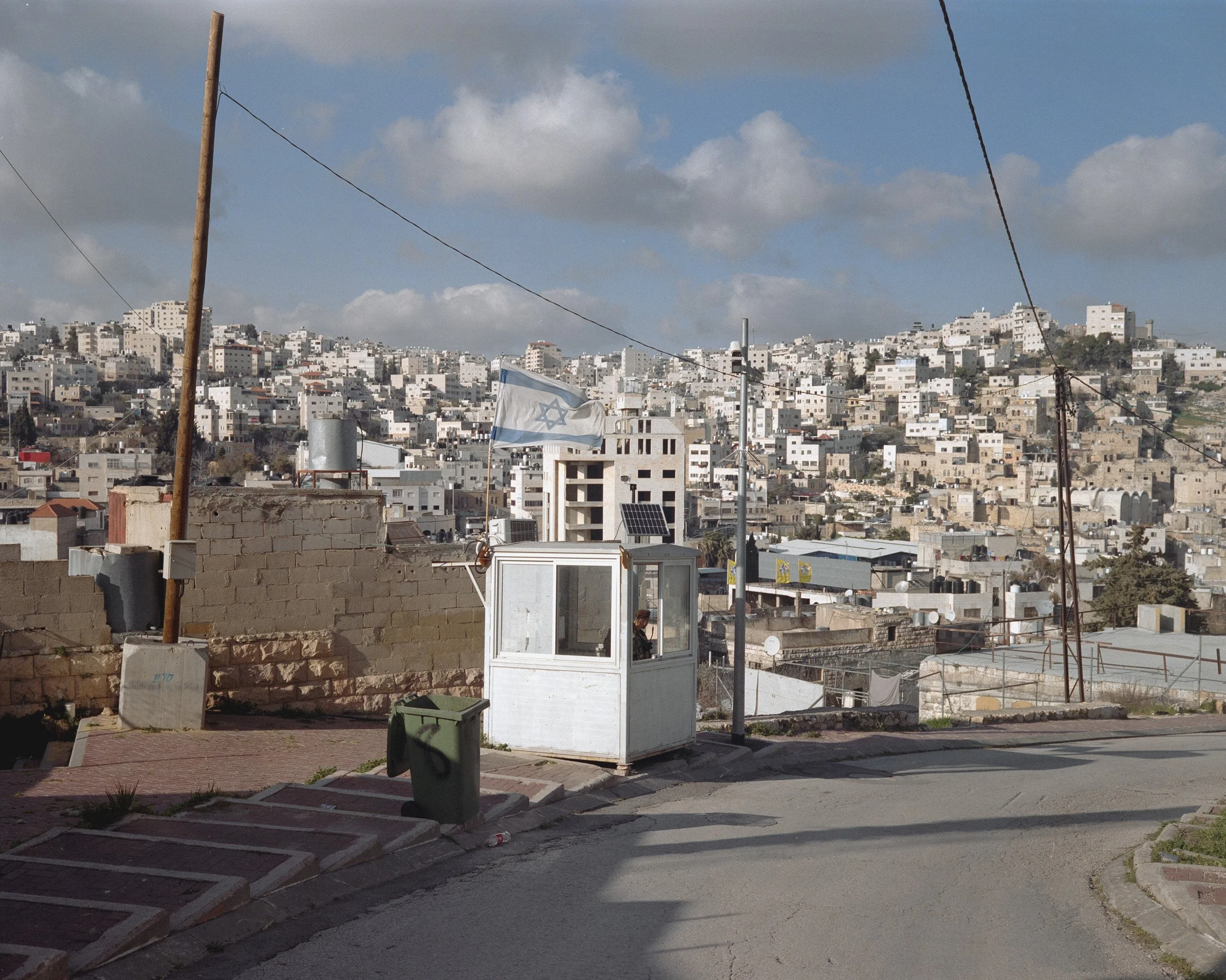 Security post on Tel Rumeida Street in Hebron, in area H2. The 500 settlers who live in downtown Hebron are protected by 2,000 Israeli soldiers, a ratio of 4 to 1.  H2 has 21 checkpoints. March 27, 2022.