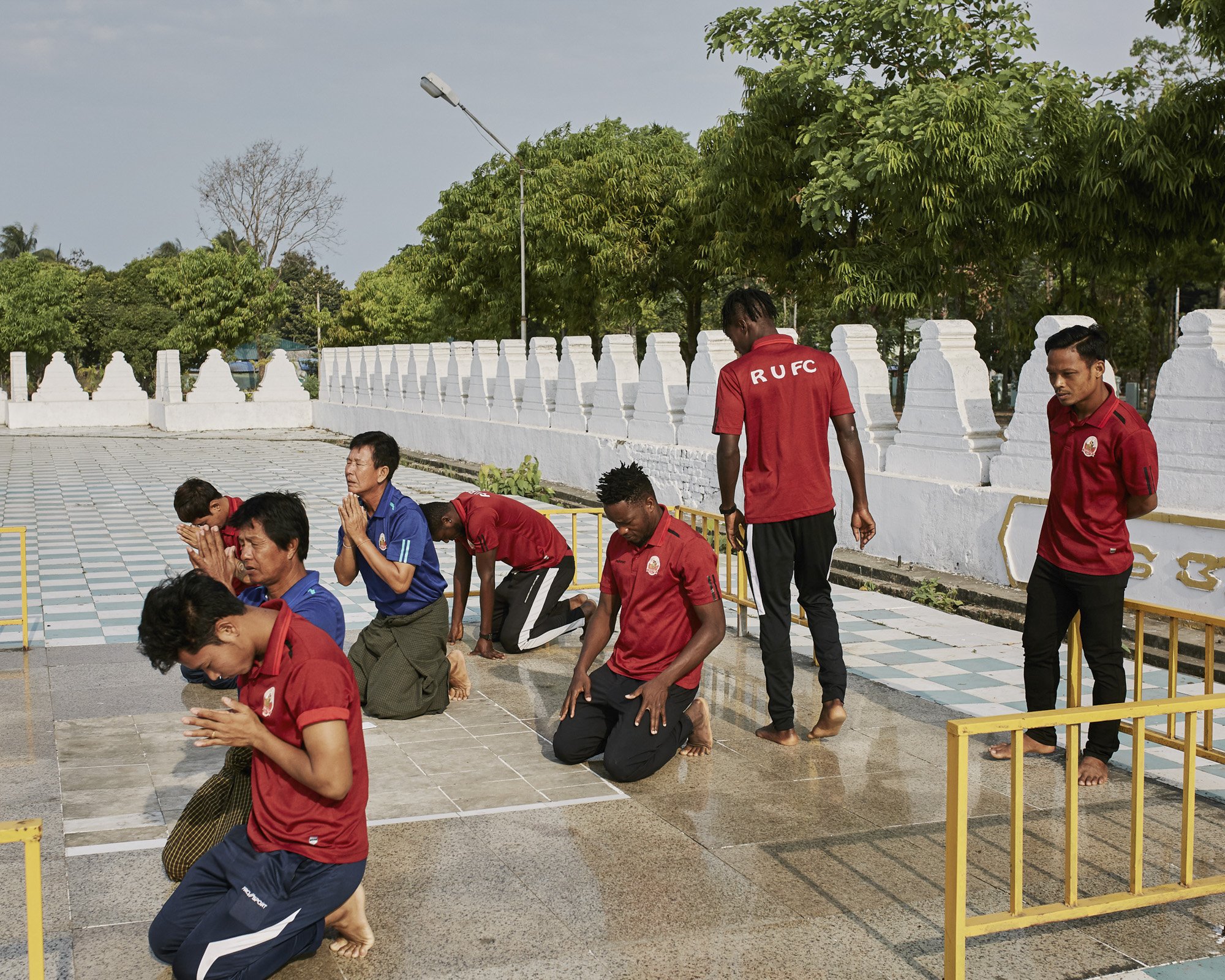 The RUFC players visit the Lawkananda pagoda of Sittwe, Rakhine State, Myanmar. April 7th 2019. © Lucien Lung / Riva