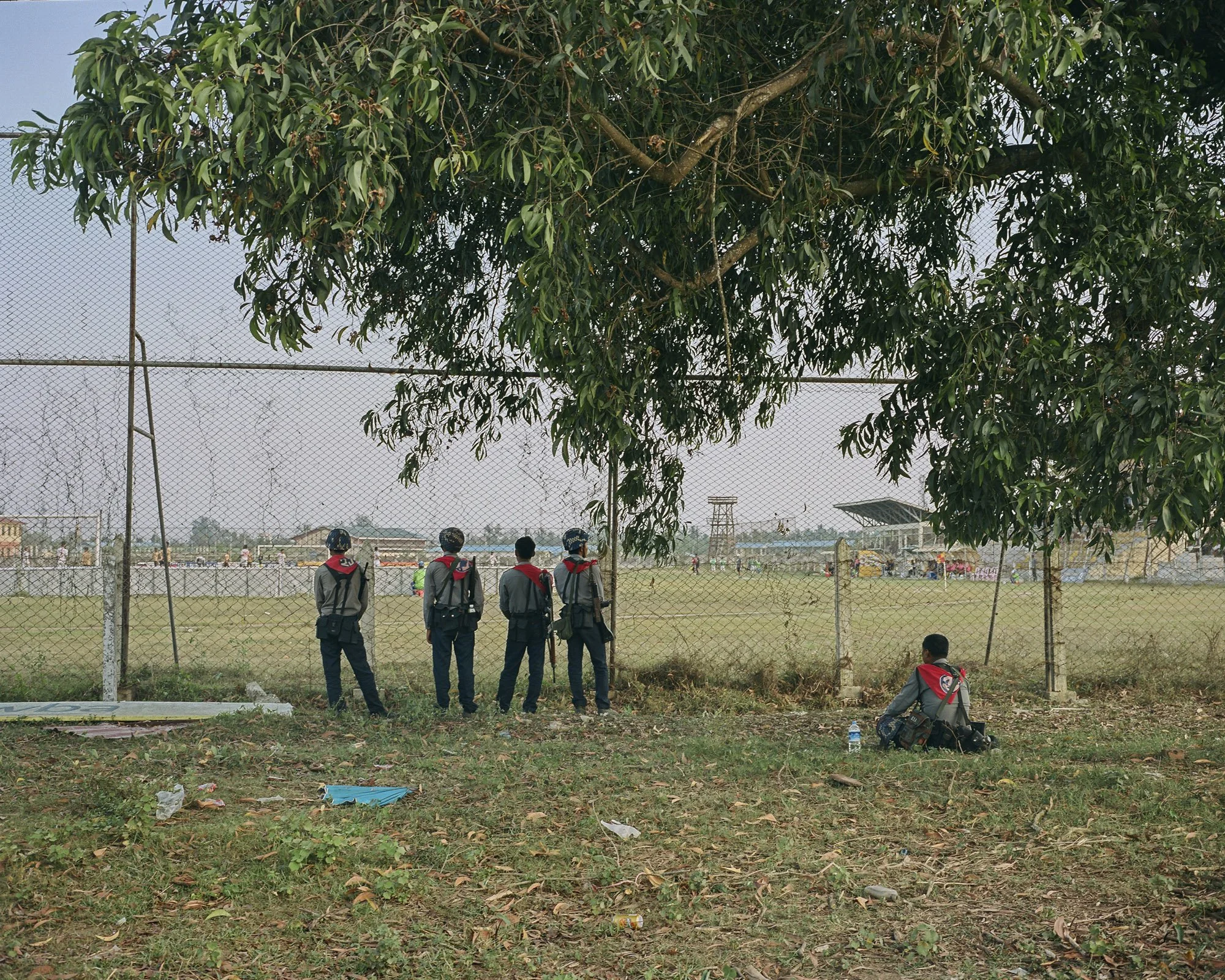 Police watch the game between the Rakhine United FC and Chinland FC, Watharli Stadium, Sittwe, Rakhine State, Myanmar. April 7th 2019. © Lucien Lung / Riva