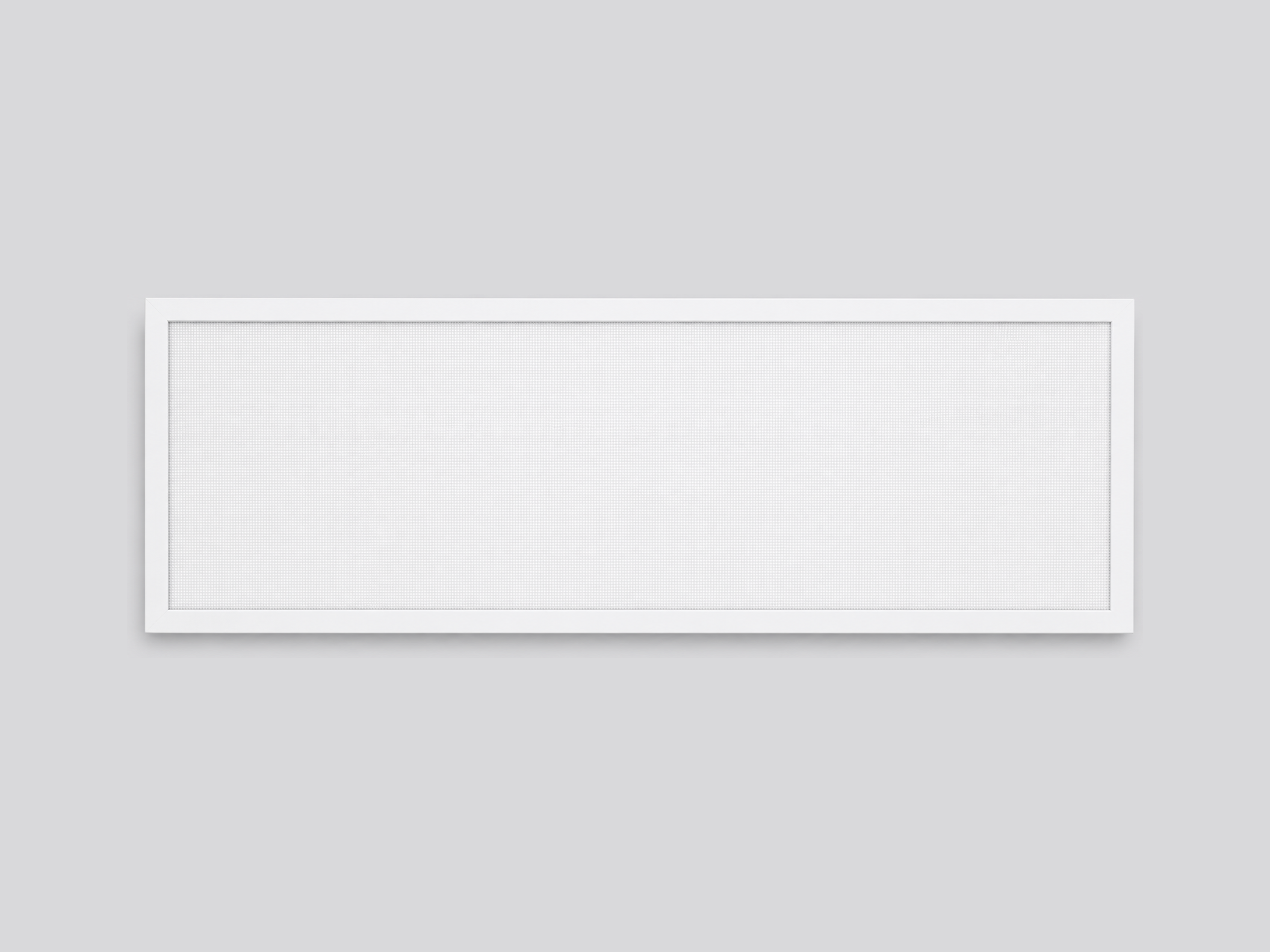A white rectangular air vent cover with a frame on a light gray surface.