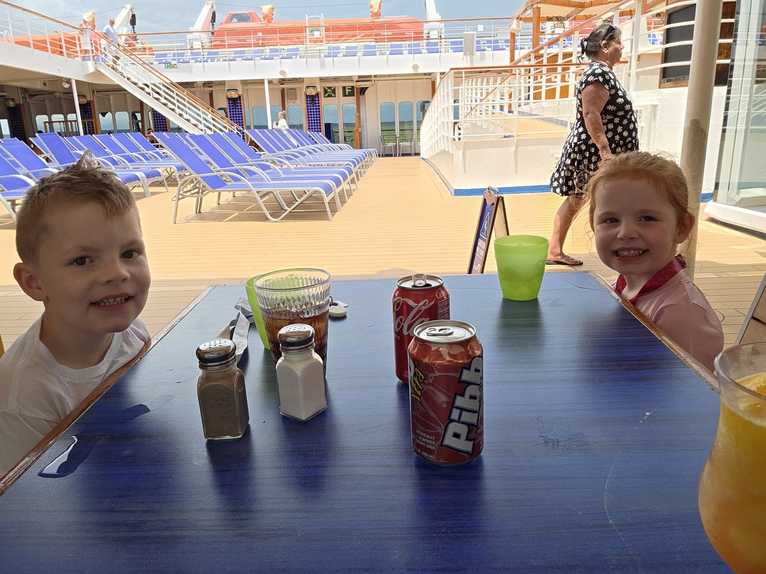 Family enjoying time together on a cruise ship deck