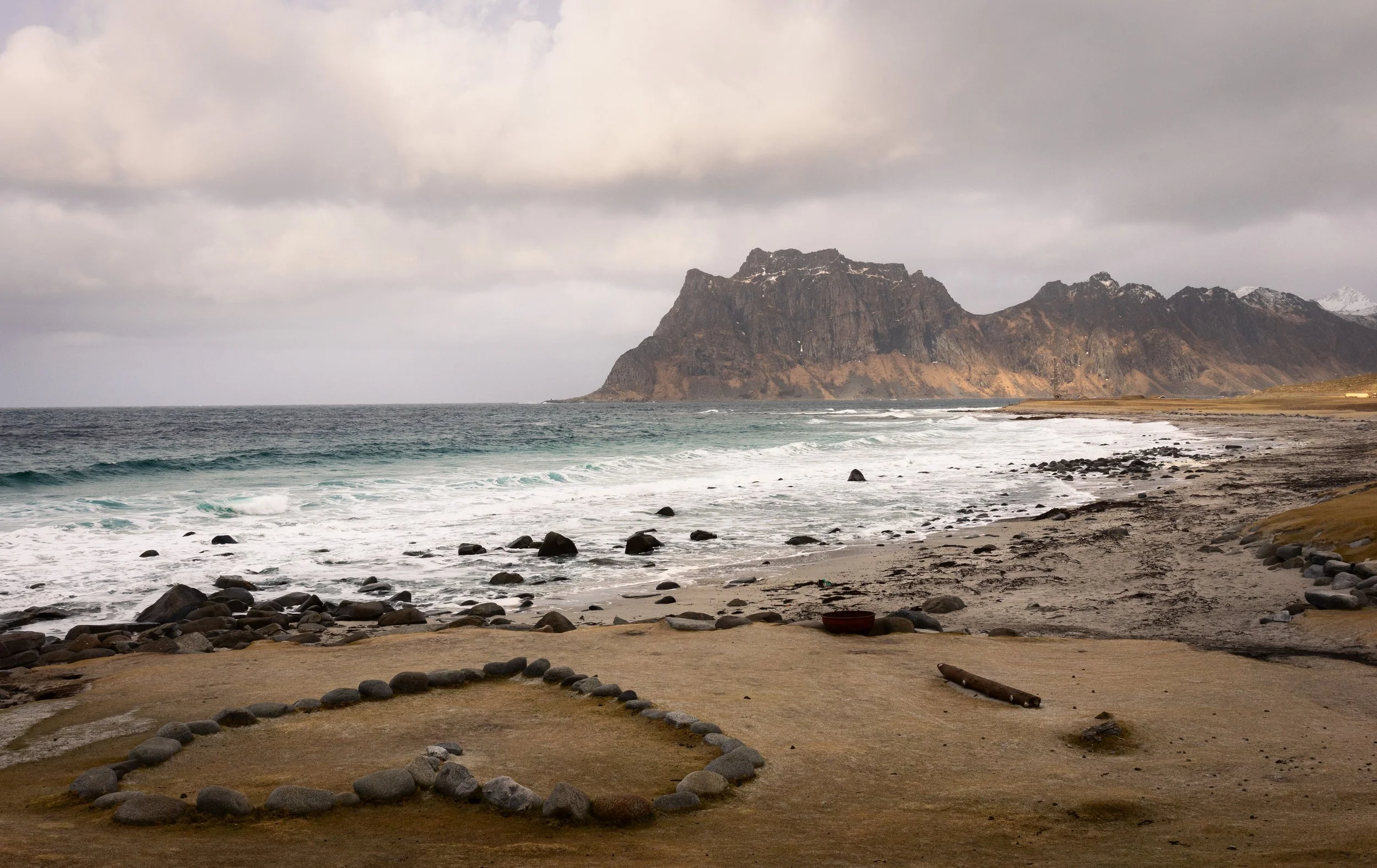 A ring of stones on the foreshore at Uttakleiv, Lofoten, Norway — a beach better known for what happens over it, facing due north into the aurora.