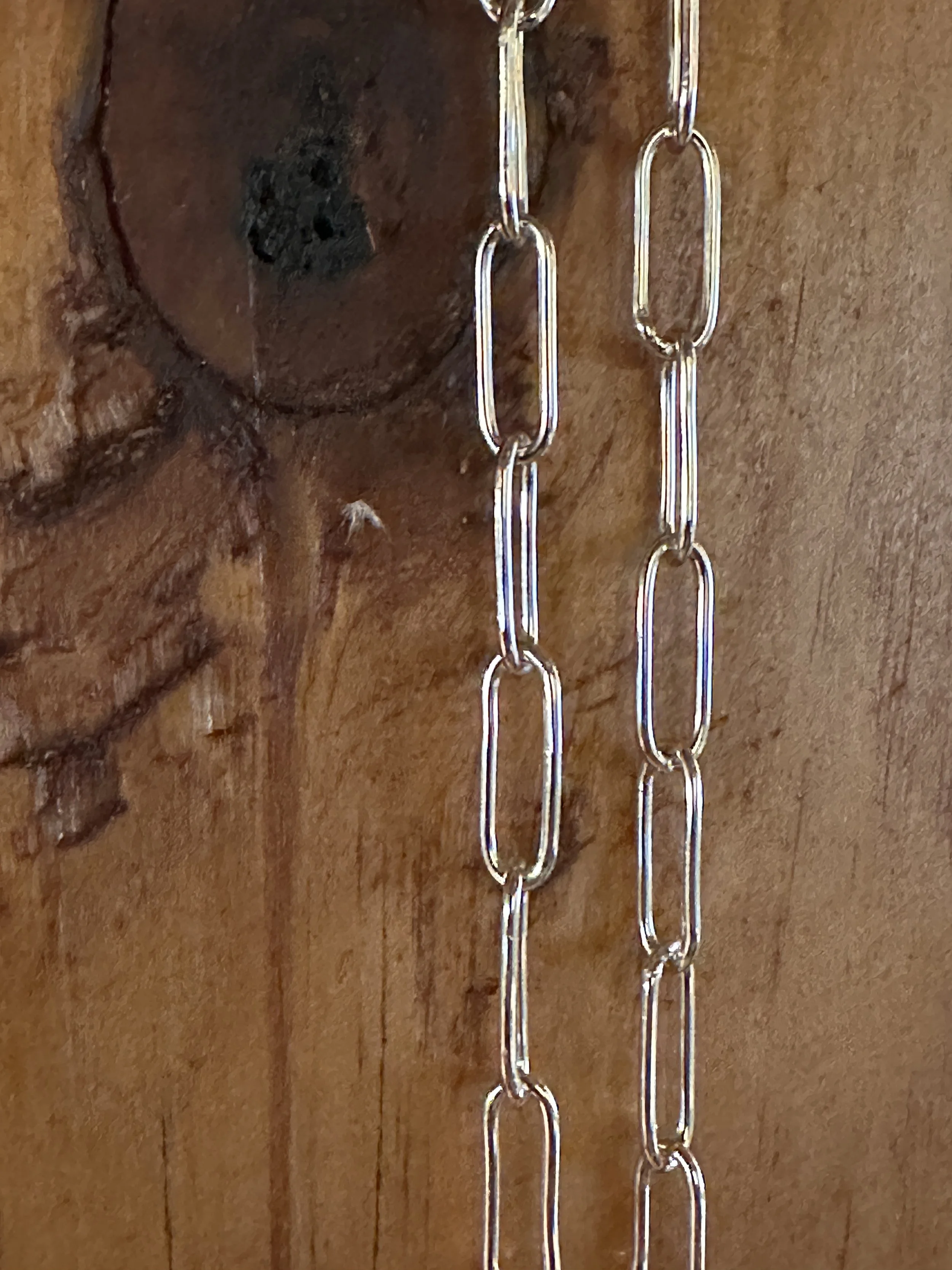 Close-up of hand-formed sterling silver paperclip links