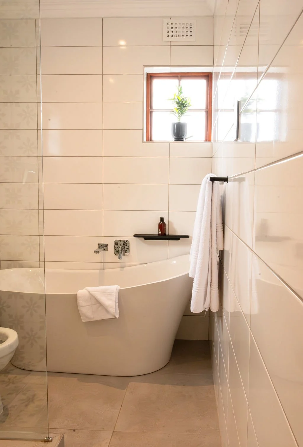 freestanding-bathtub-tiled-bathroom-window.jpg
