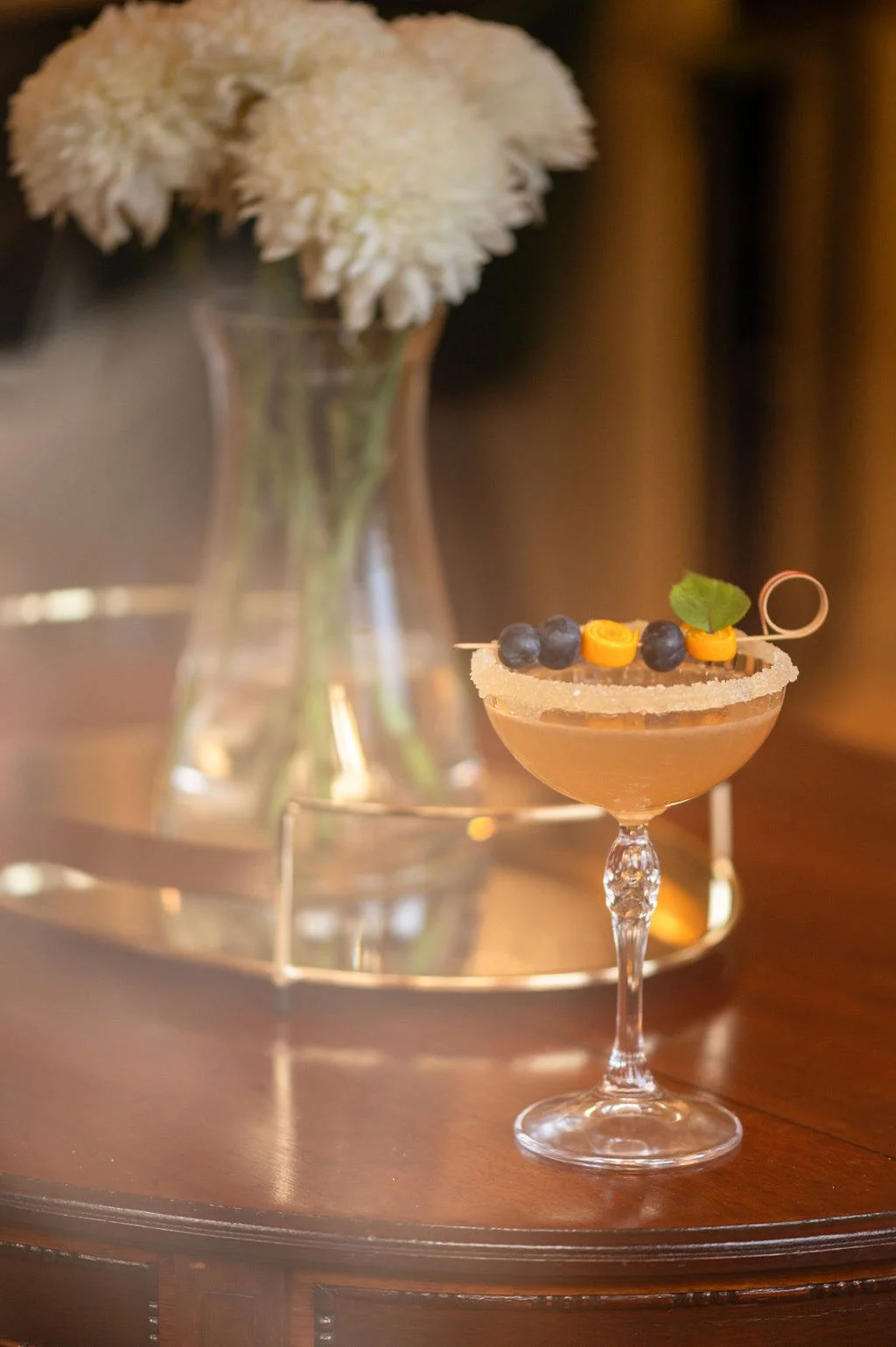 garnished-cocktail-white-flowers-bar-table.jpg