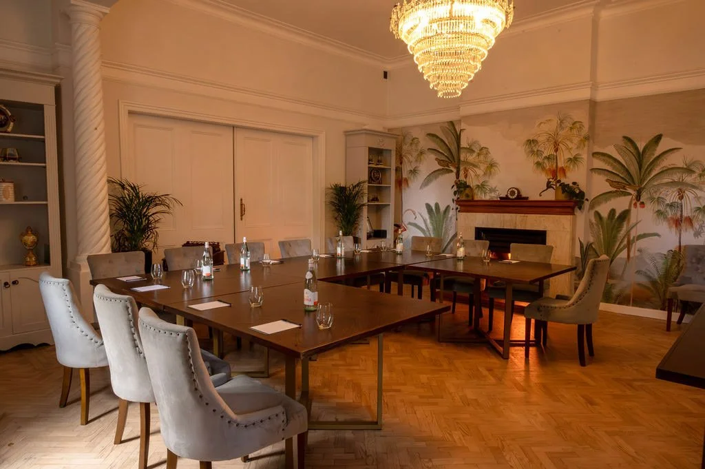 boardroom-palm-mural-chandelier-meeting.jpg