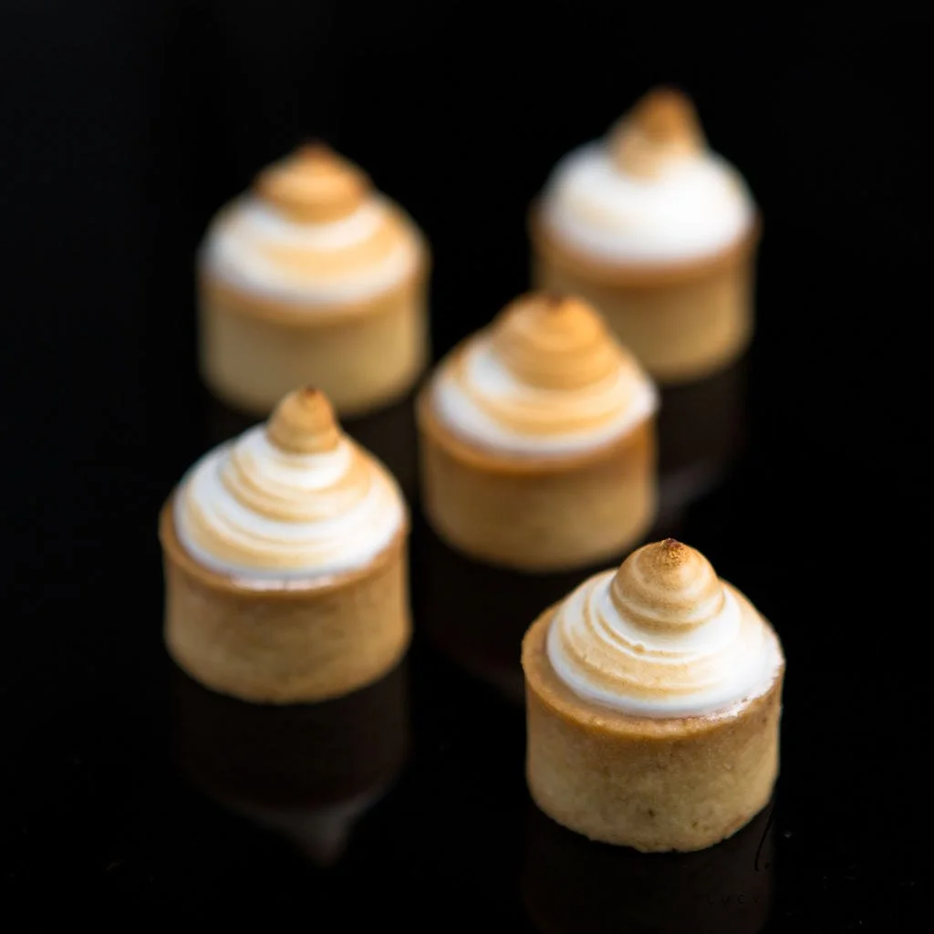 mini-lemon-meringue-tarts-on-black.jpg