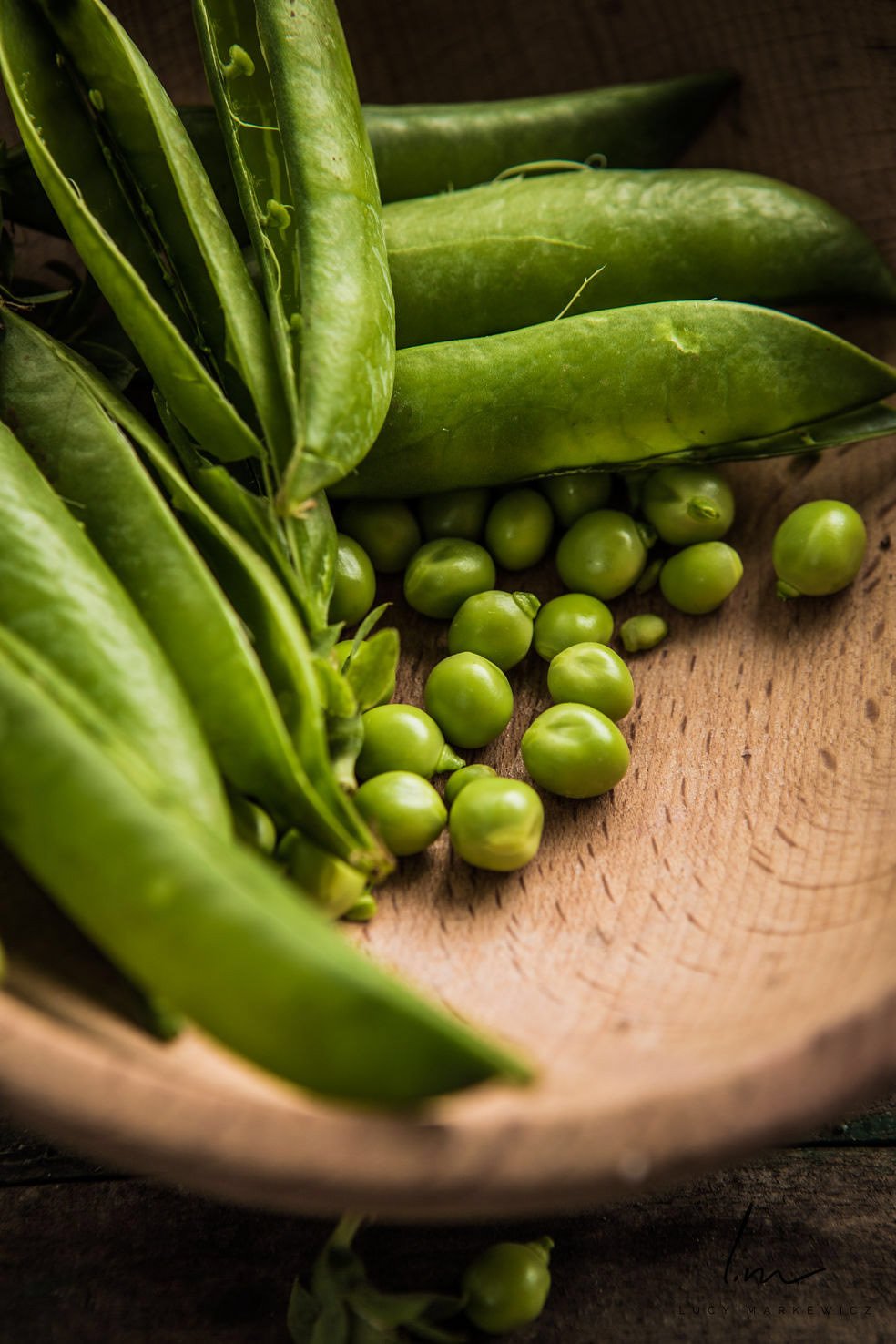 fresh-peas-in-pods-on-wood-plate.jpeg