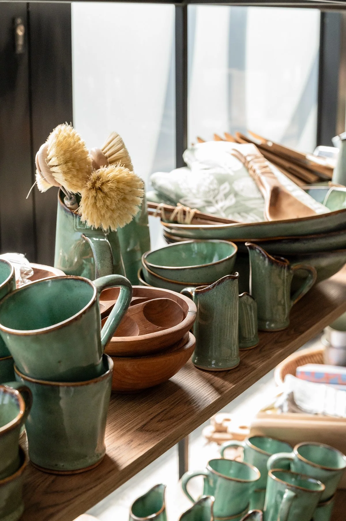 green-glazed-ceramics-retail-shelf.jpg