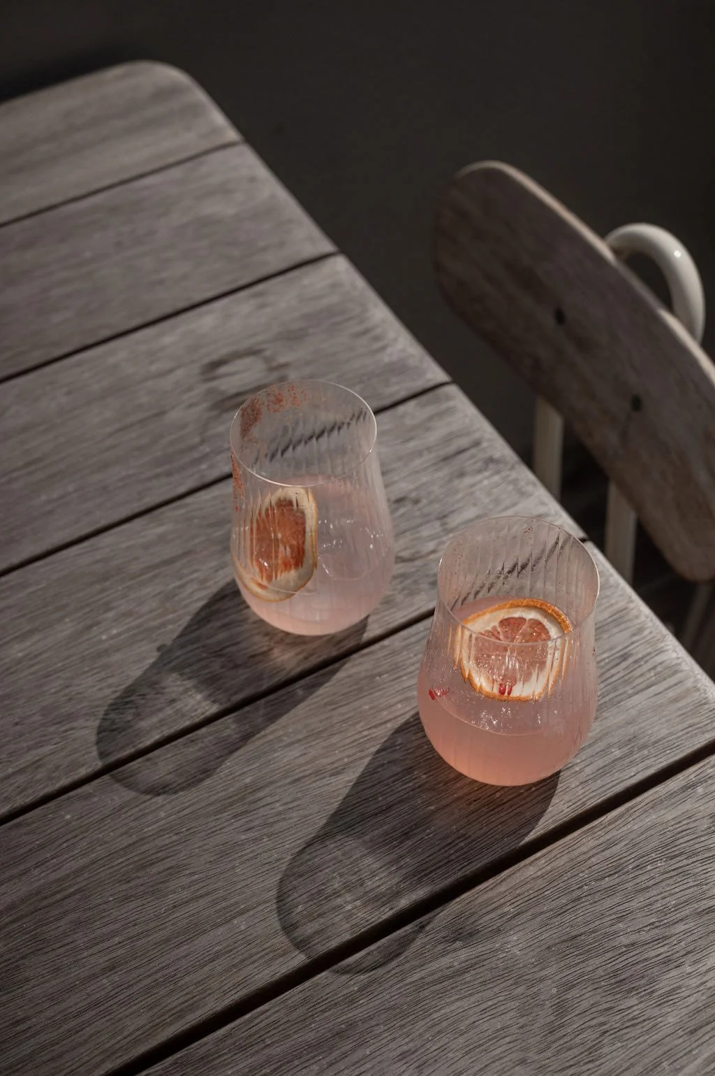 grapefruit-cocktails-outdoor-wood-table.jpg