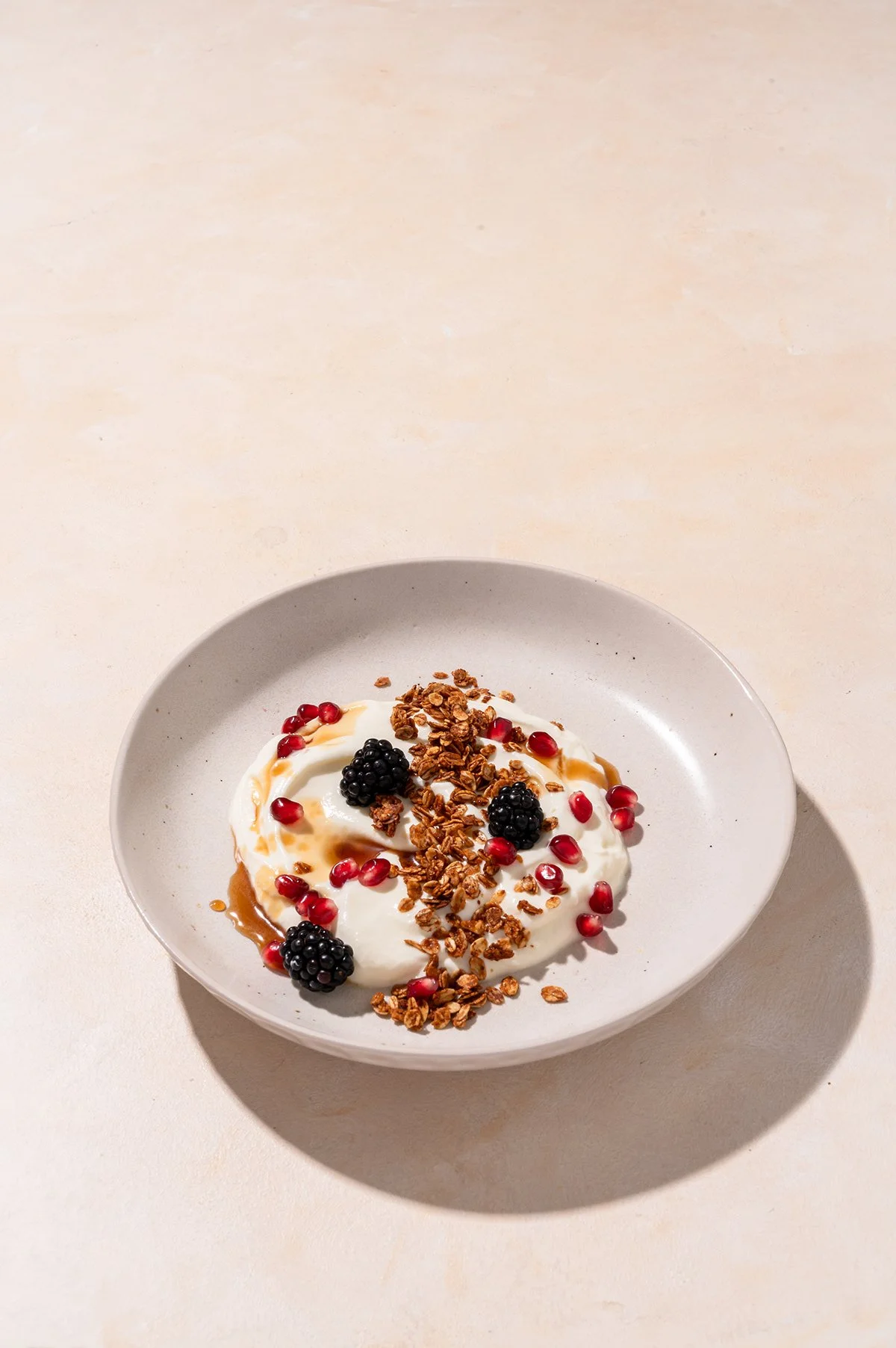 yogurt-bowl-granola-berries-overhead.jpg