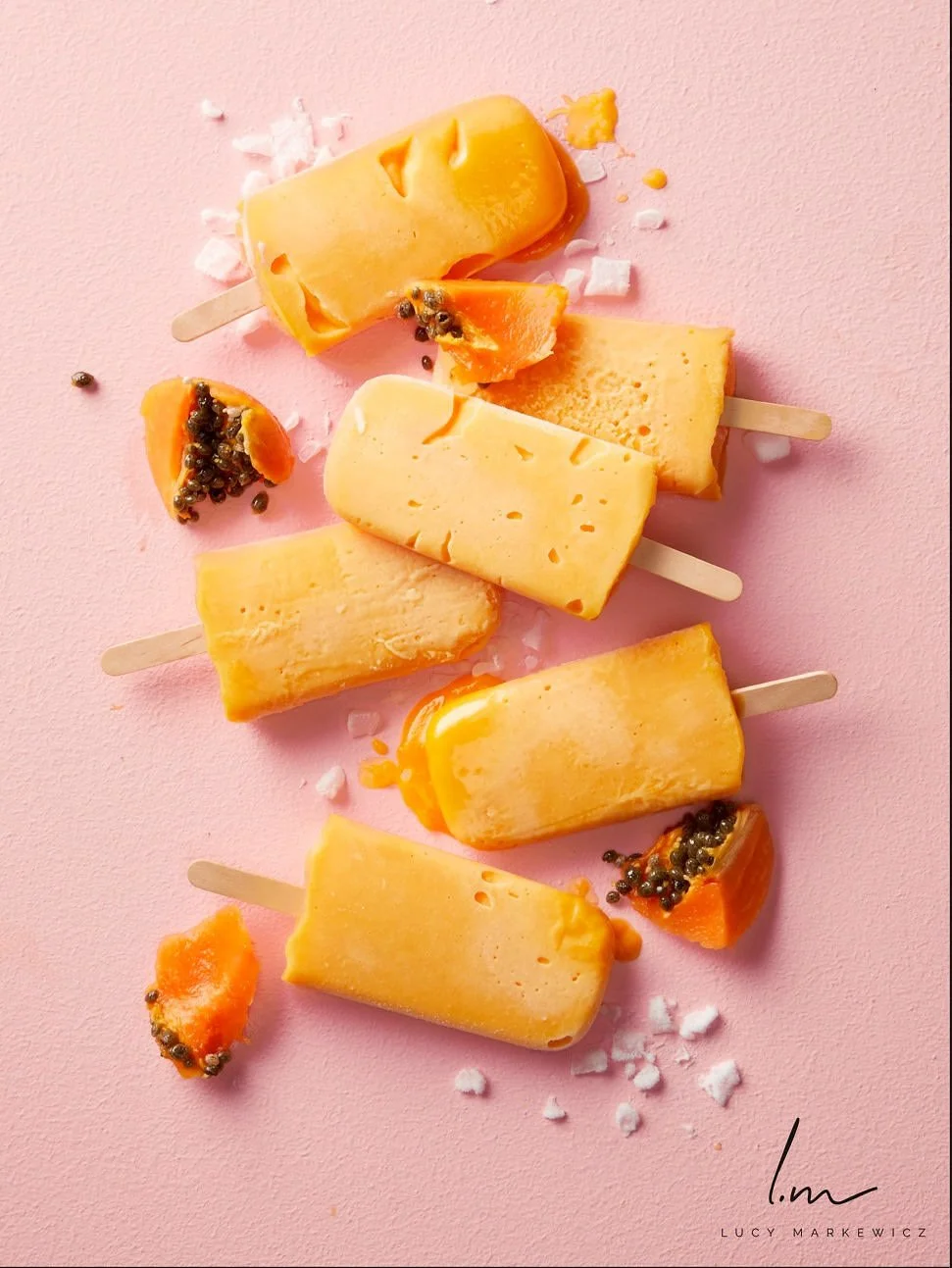 orange-papaya-popsicles-on-pink.jpeg