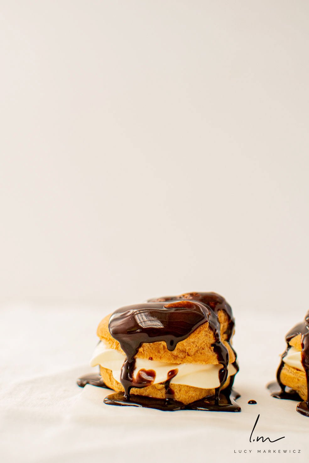 cream-puffs-with-chocolate-ganache-drizzle.jpg