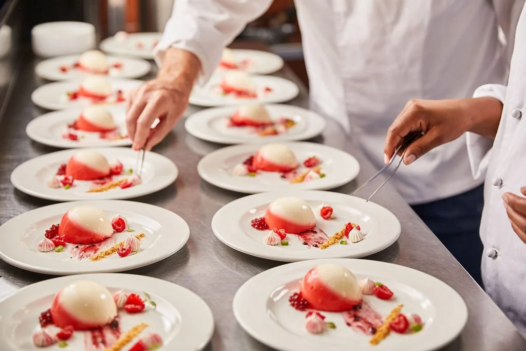 chefs-plating-pink-mousse-dessert-catering.jpg