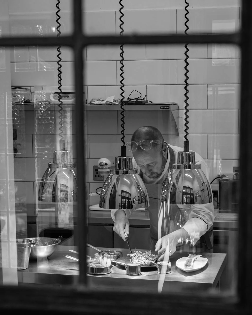 palm-house-hotel-chef-plating-black-and-white.jpg