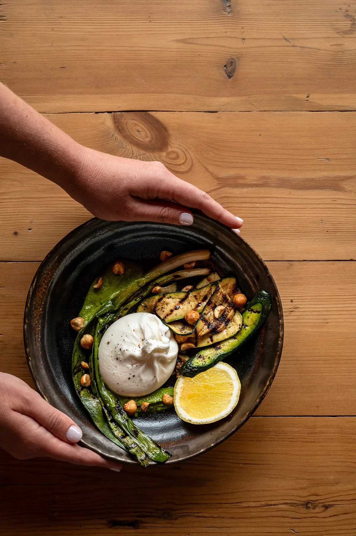 burrata-dish-presentation-hands-overhead.jpg