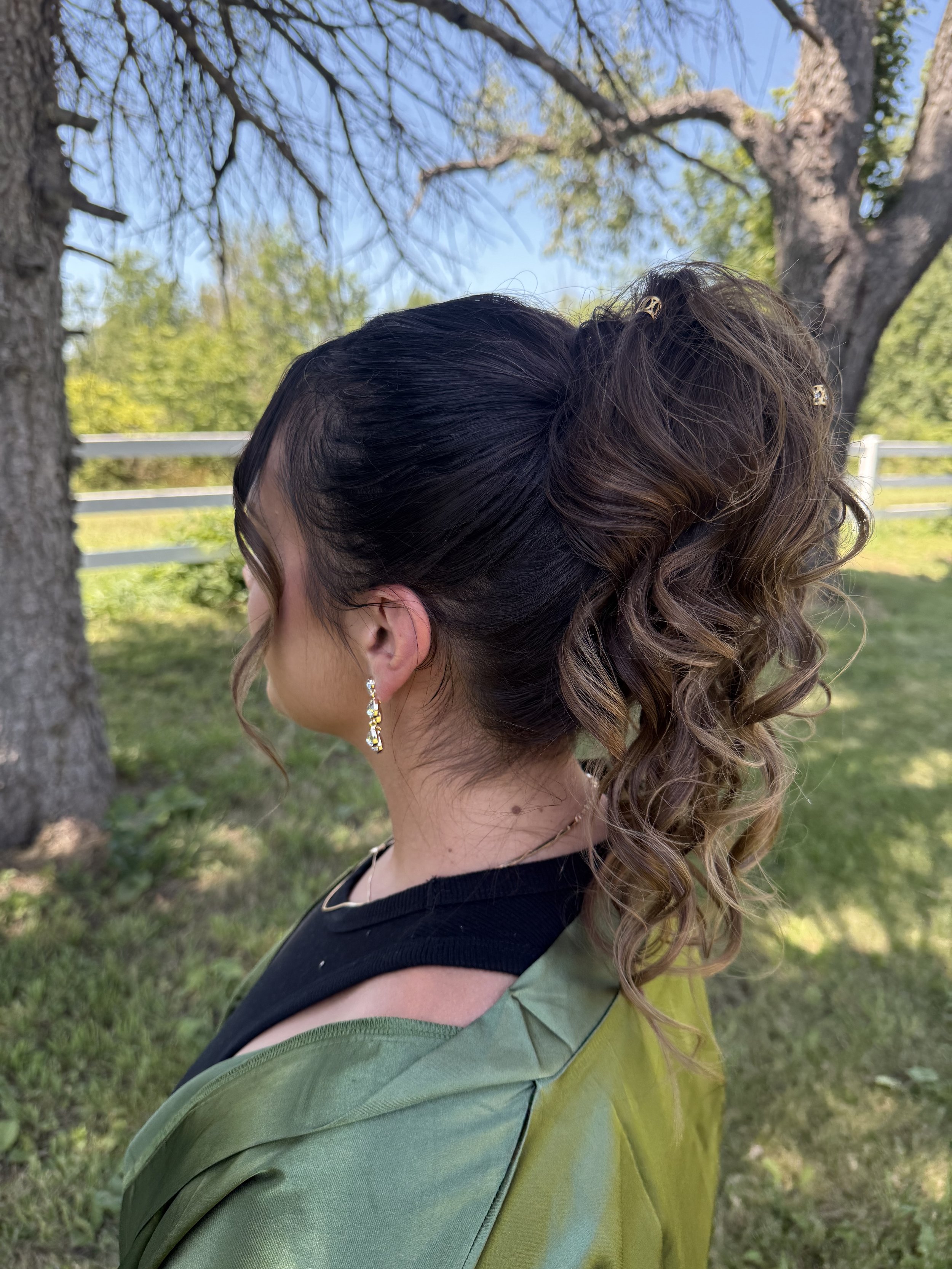 Textured bridal ponytail with soft curls