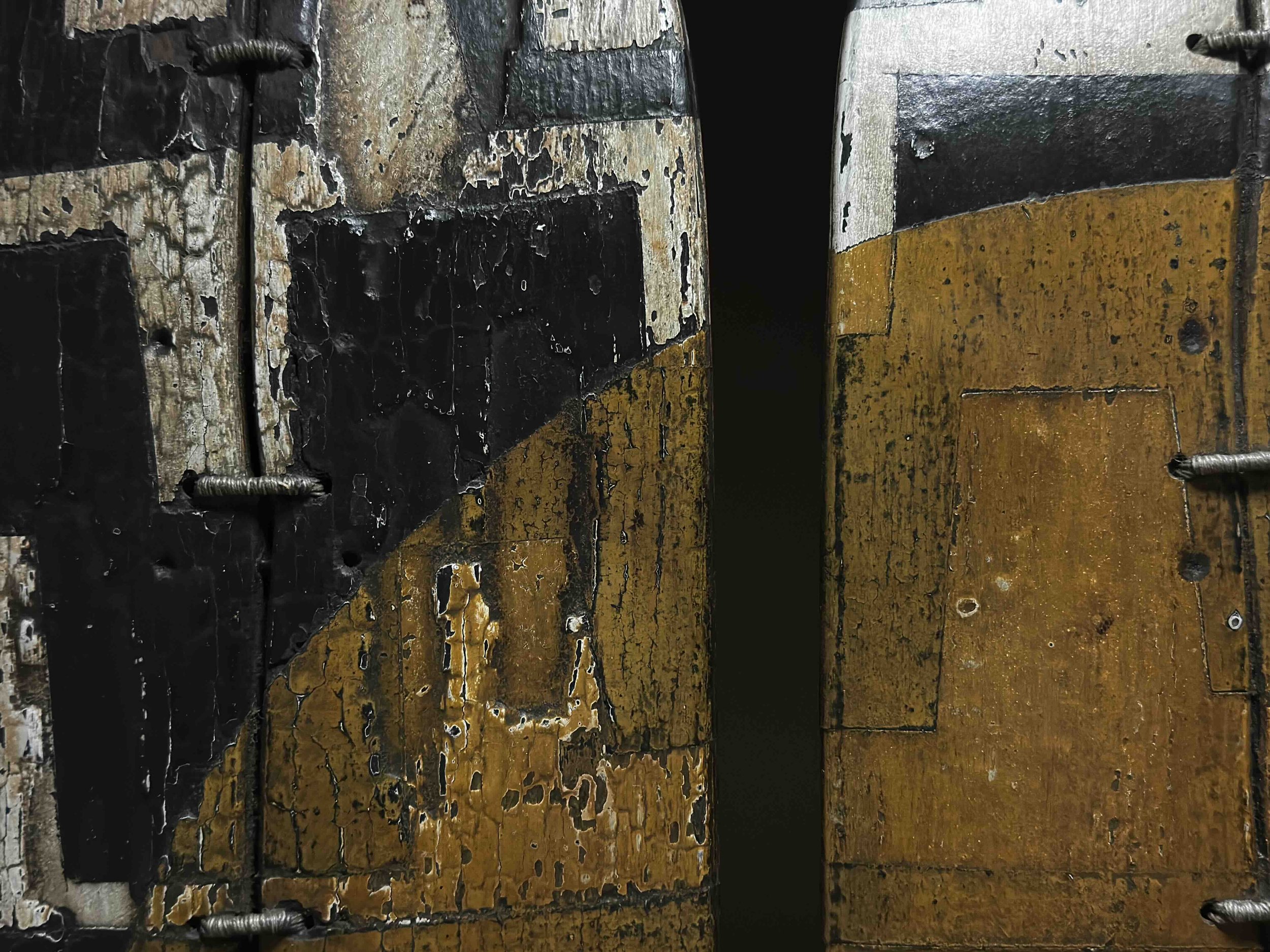 Close-up detail of the yellow circle motif and panel seams on George Peterson's LINGO Yellow Triptych sculpture.