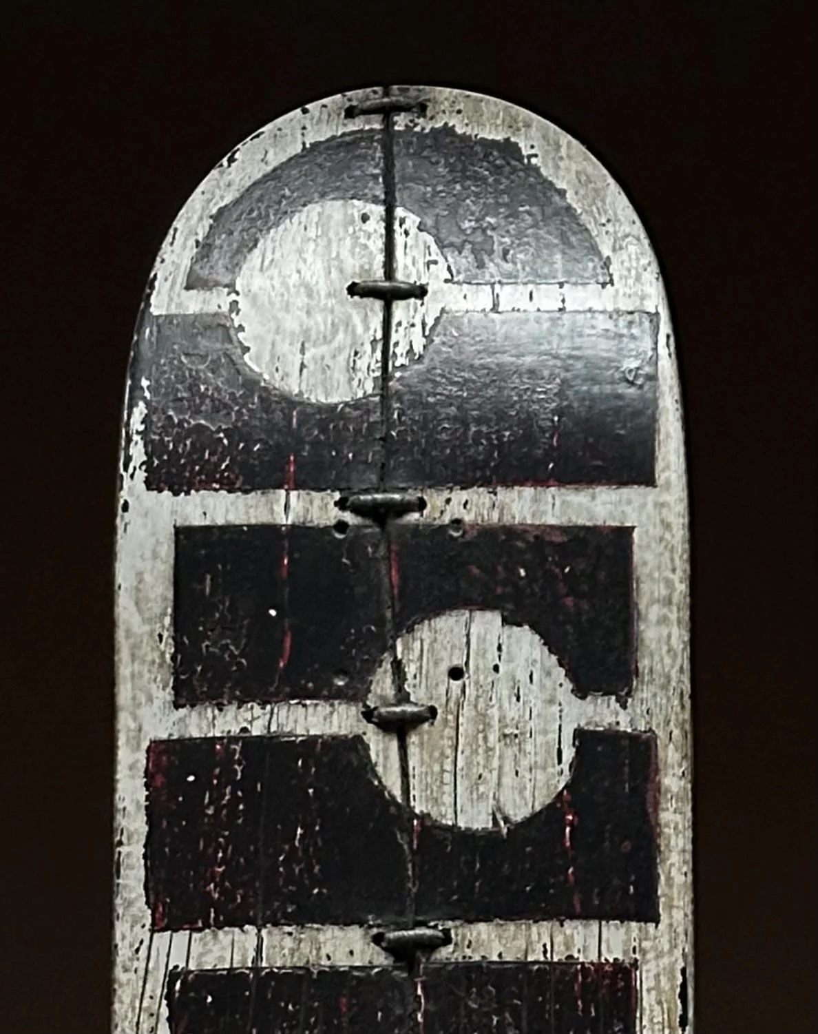 Close-up detail of the offset black circle shapes and deck texture on George Peterson's LINGO Offset Circles sculpture.