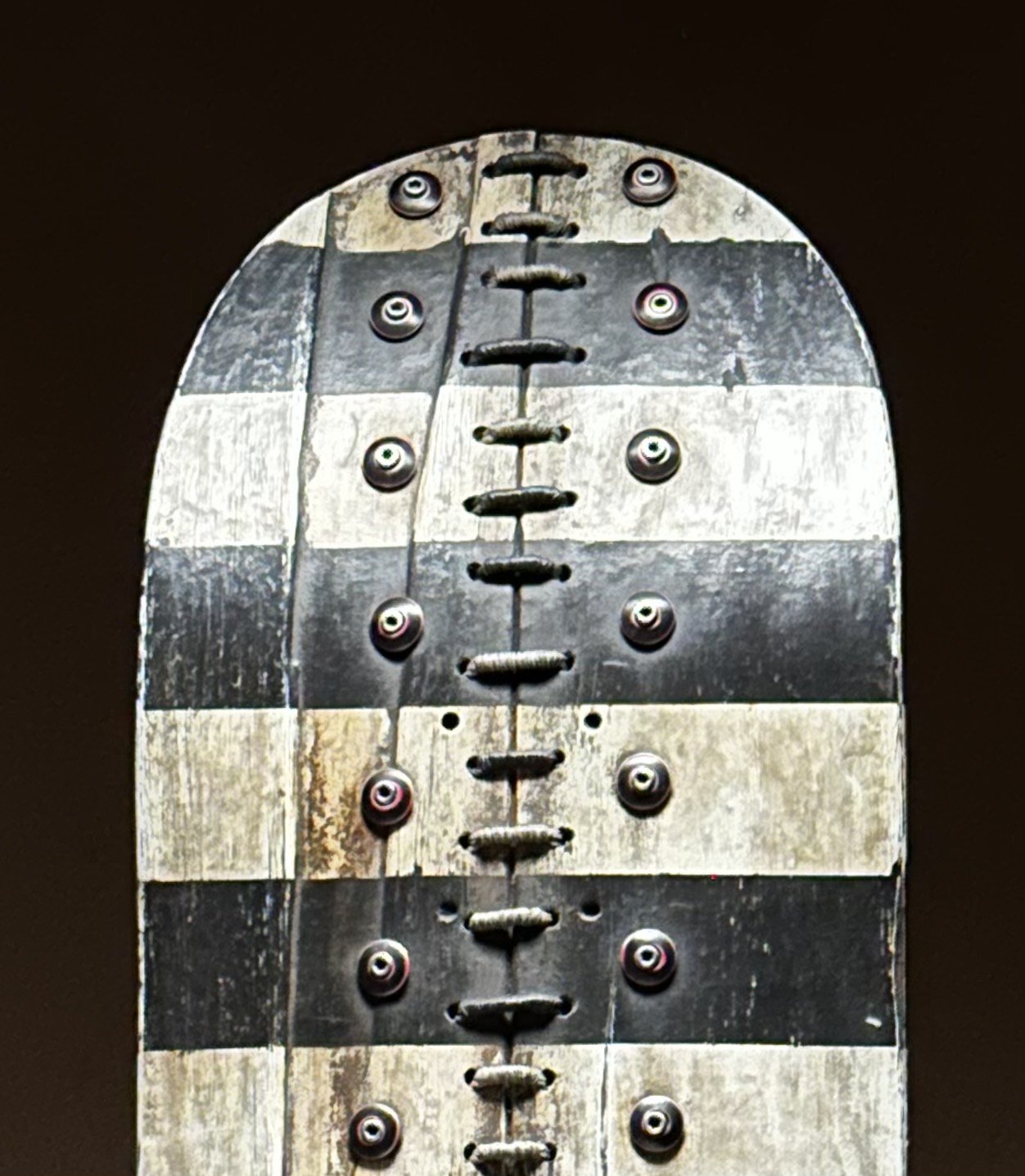 Close-up detail of hand-stitched thread and vintage buttons on George Peterson's LINGO Button Stitch sculpture.