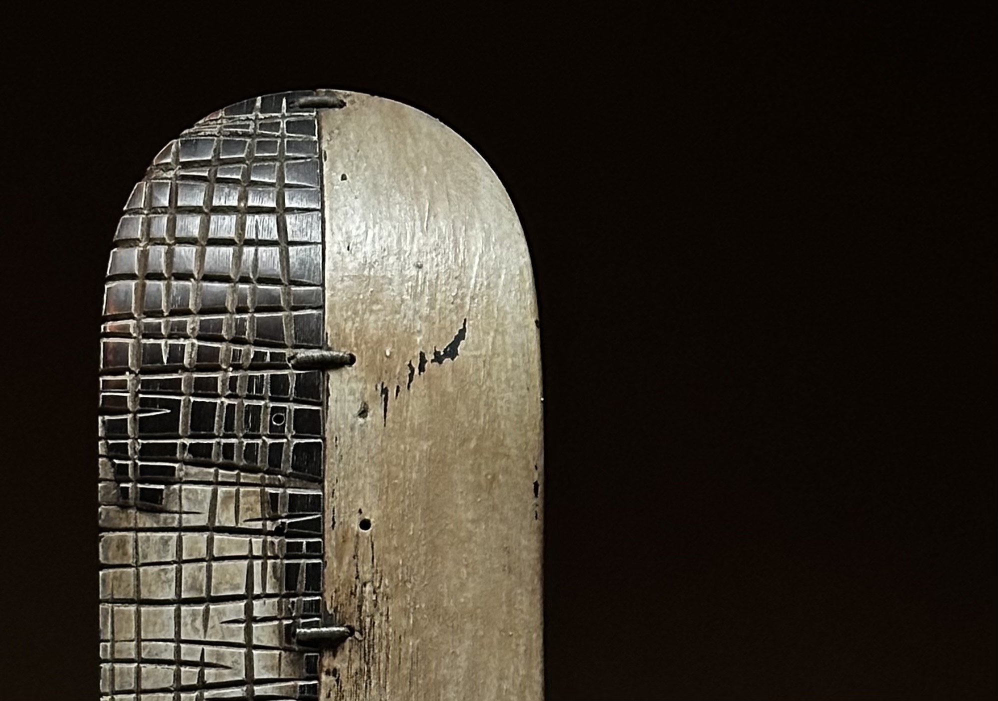 Close-up detail of the hand-woven texture on George Peterson's LINGO Woven Side sculpture.