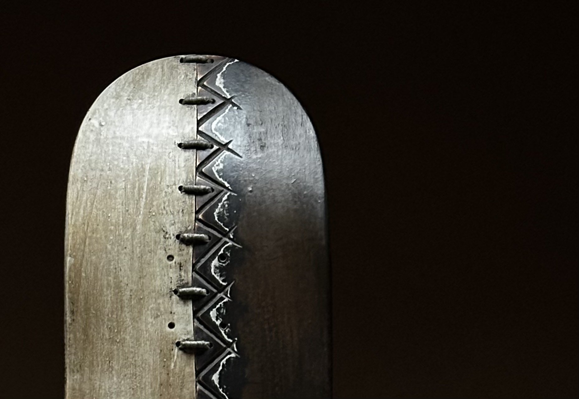 Close-up detail of the hand-stitched zigzag pattern on George Peterson's LINGO Zigzag Stitch sculpture.