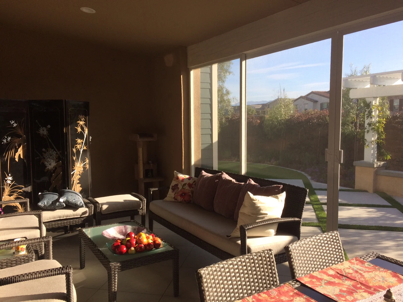 Living area amenities abound in this screened porch.