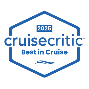 CruiseCritic badge for Best in Cruise 2025 with a blue hexagon shape and wave icon.