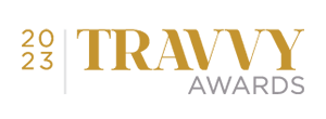 2023 Travyy Awards logo with text in gold and gray