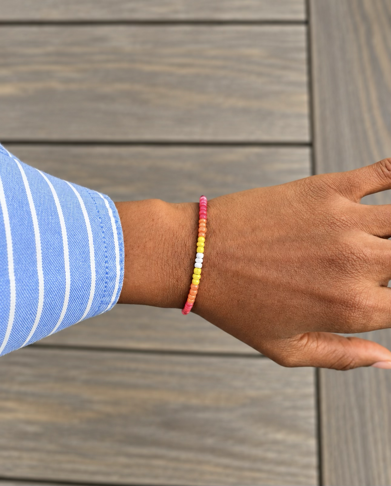 Colorful handmade seed bead bracelet with sunset-inspired colors