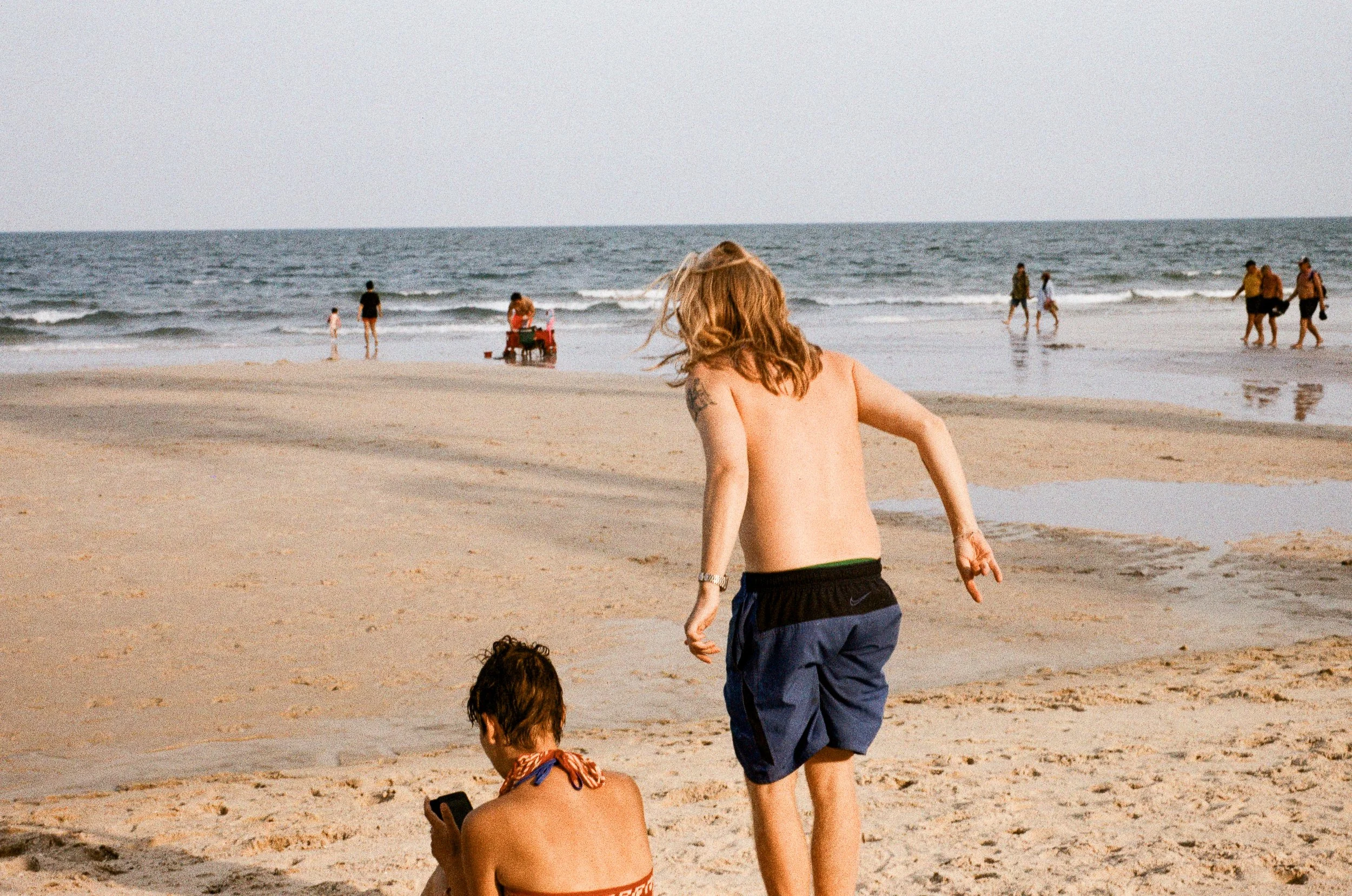 Beachgoers on the coast of Hua Hin, Thailand, captured on Leica film photography