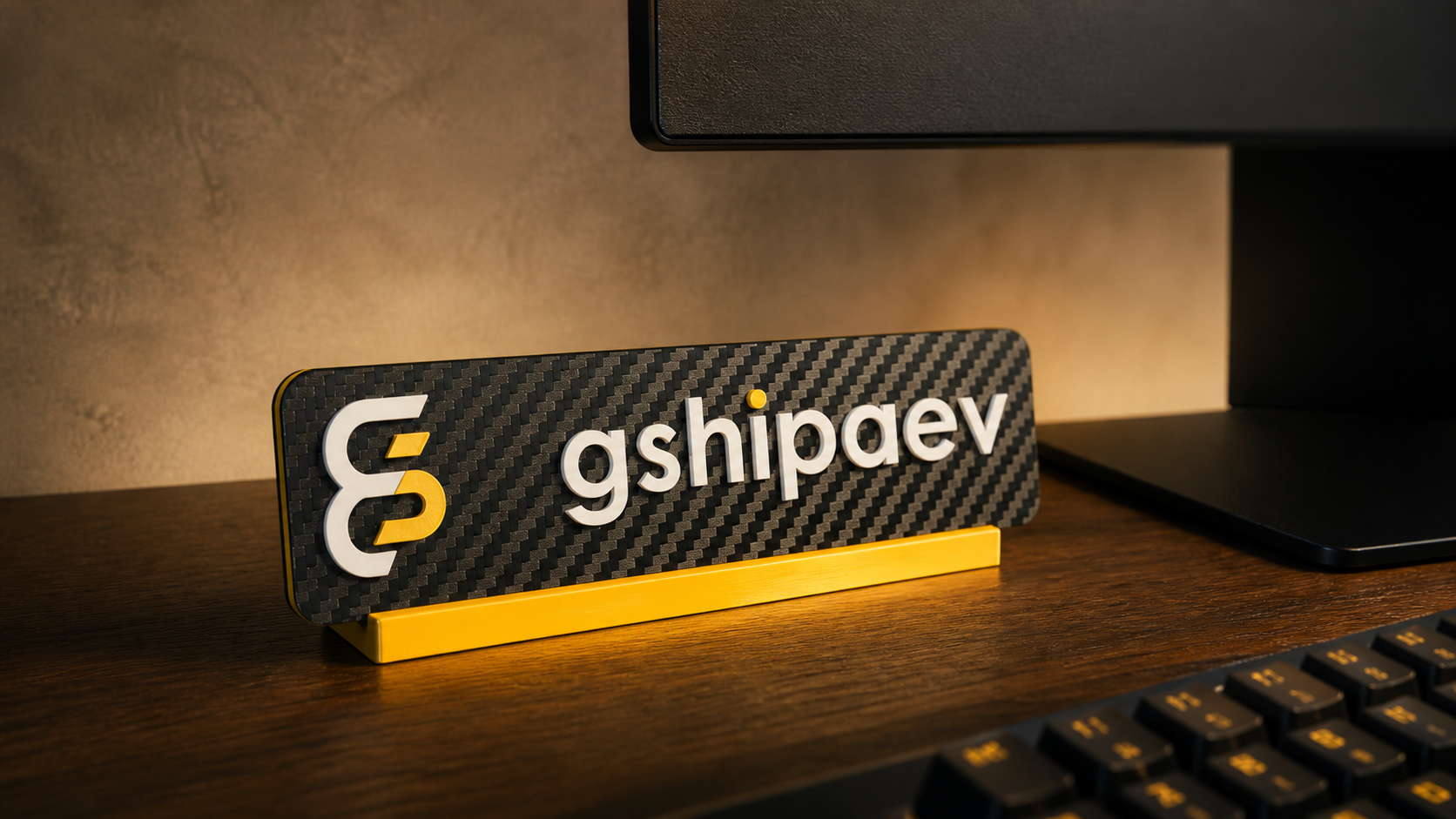 Branded gshipaev nameplate with logo on a stand.