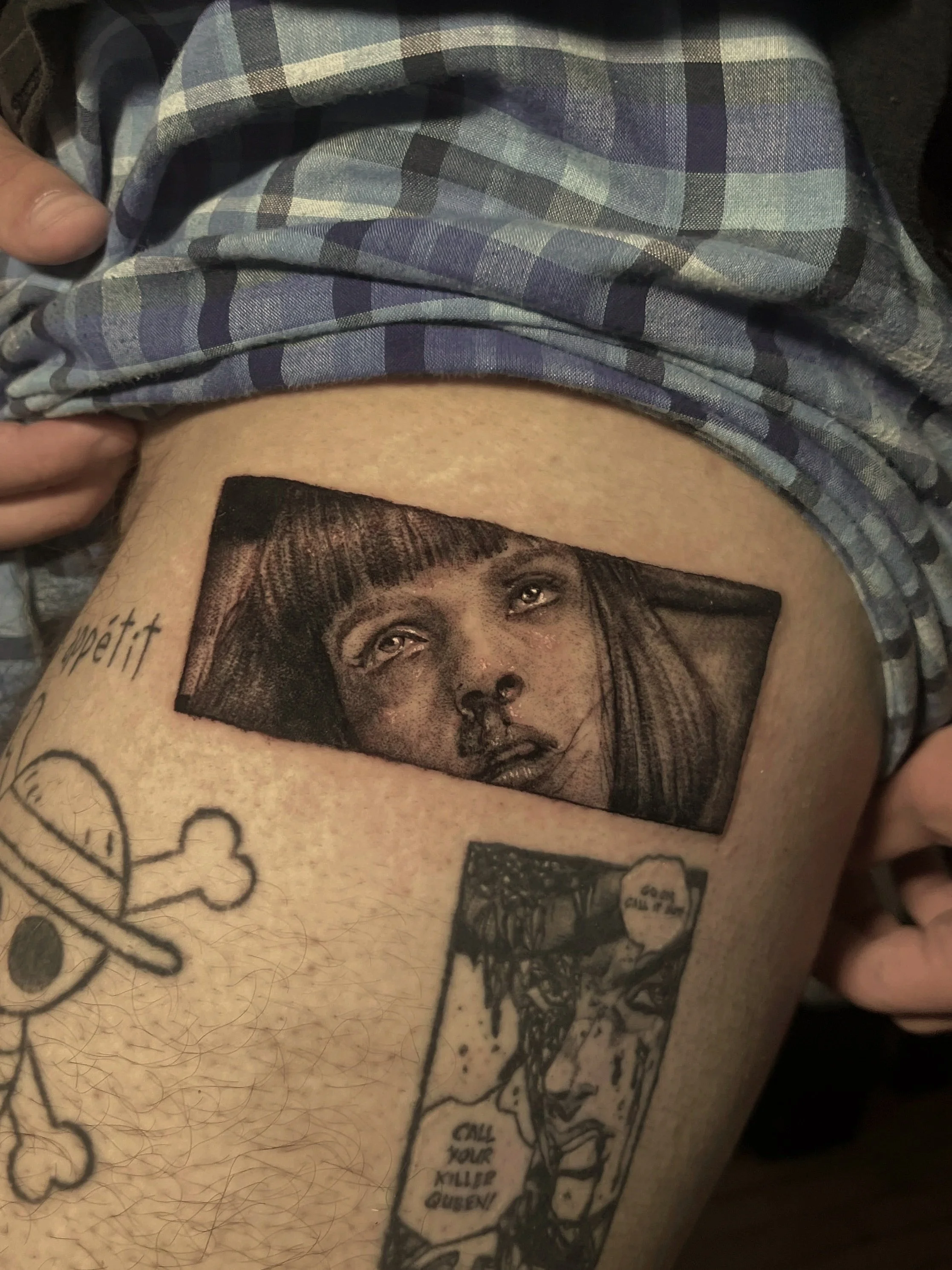A person's torso with a tattoo Mia from Pulp Fiction, Additional tattoos, including a One Piece anime tattoo and a Jojos Bizzare Adventure Tattoo