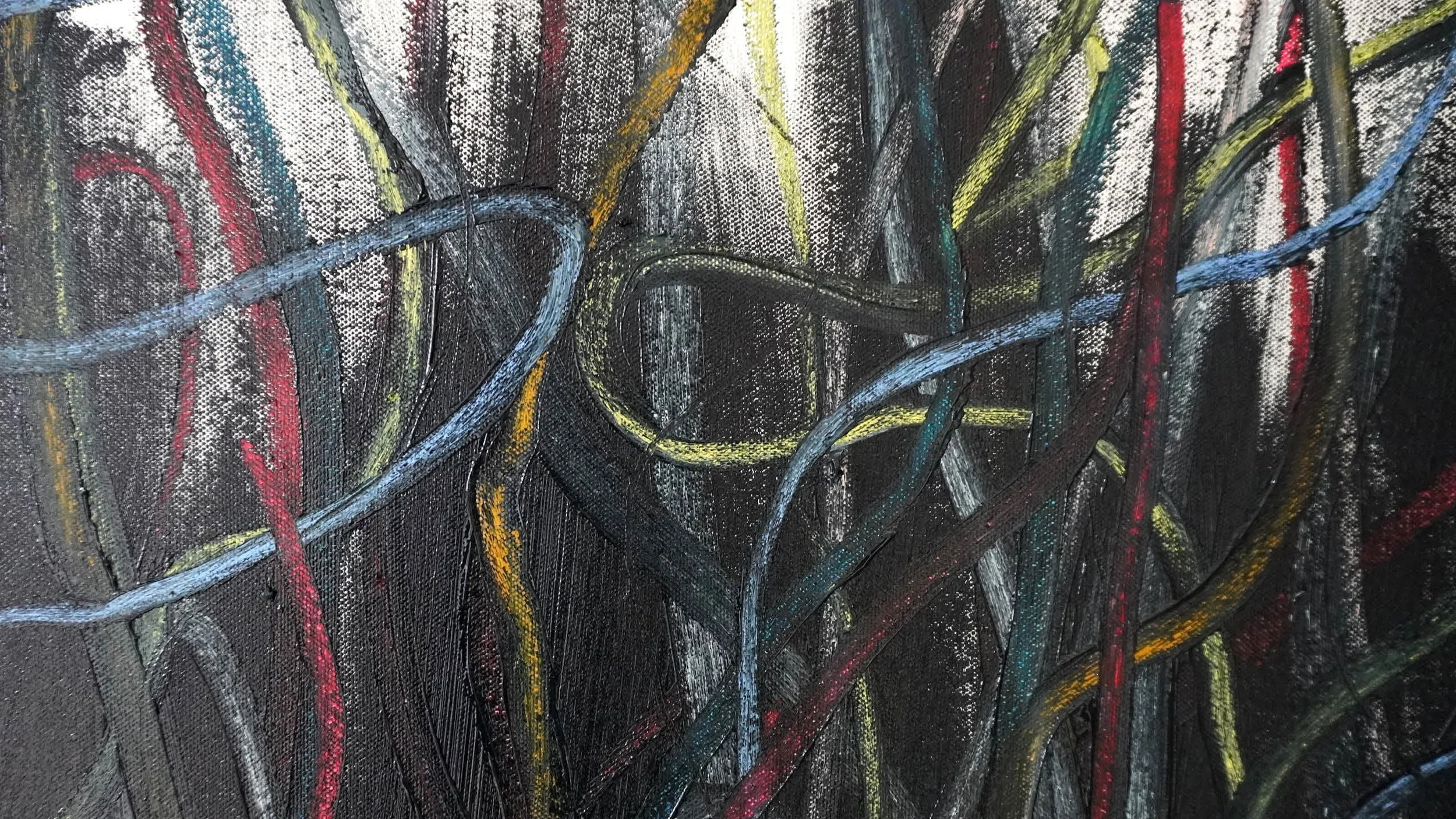 Close-up of an abstract painting with black background, featuring colorful curved and straight lines in yellow, red, blue, and white.