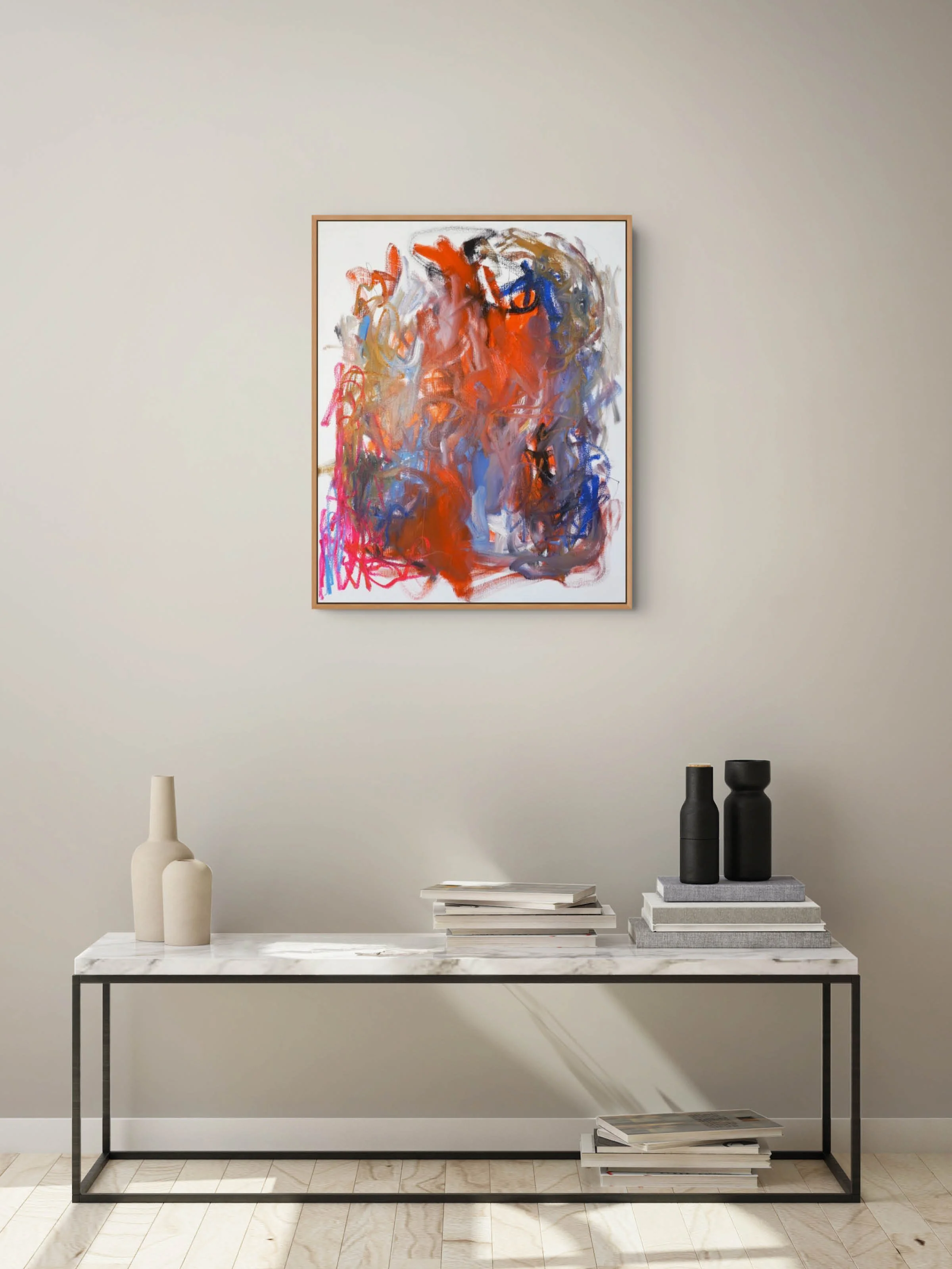 Room view of bold abstract painting in oil paints and oil sticks showing, sweeping directional gestures dominated by orange, black and blue oil paint with pops of bright pink and pale blue coloured oil sticks and graphite lines.
