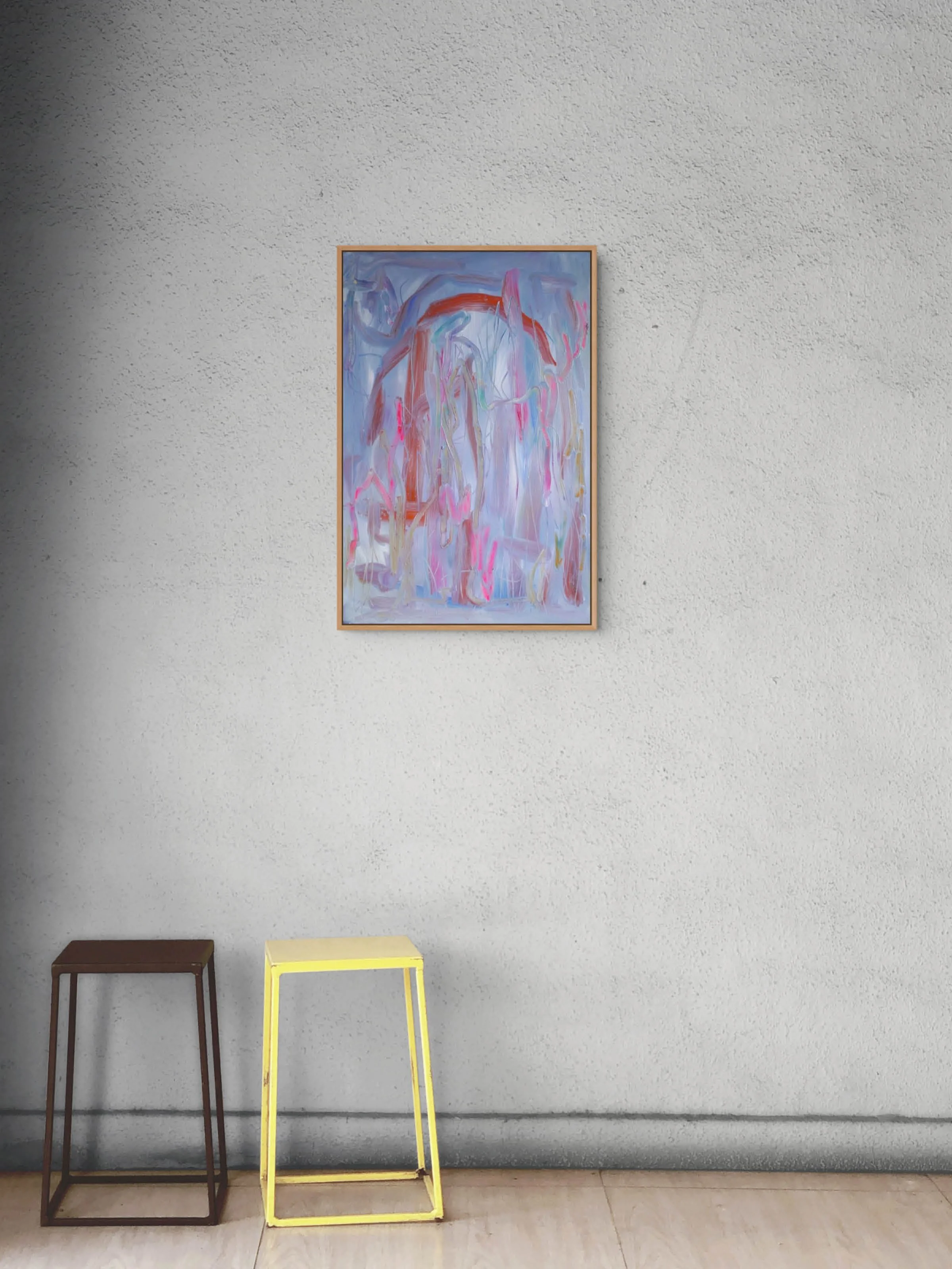 A wall with a framed abstract painting and two stools, one brown and one yellow, underneath the painting.