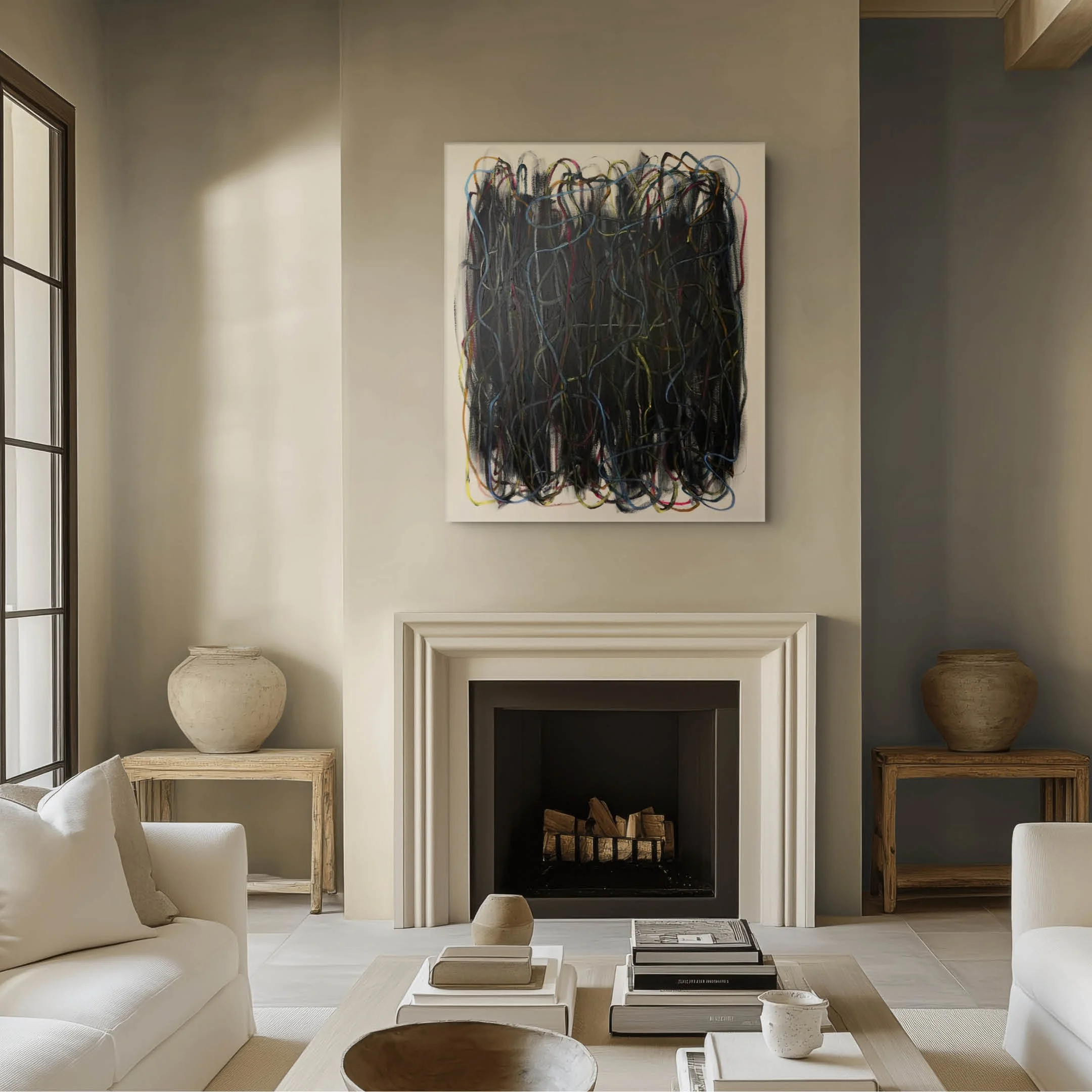 Living room with a beige sofa, a white fireplace, and neutral-colored walls adorned with an abstract painting. Decor includes various vases and wooden furniture.