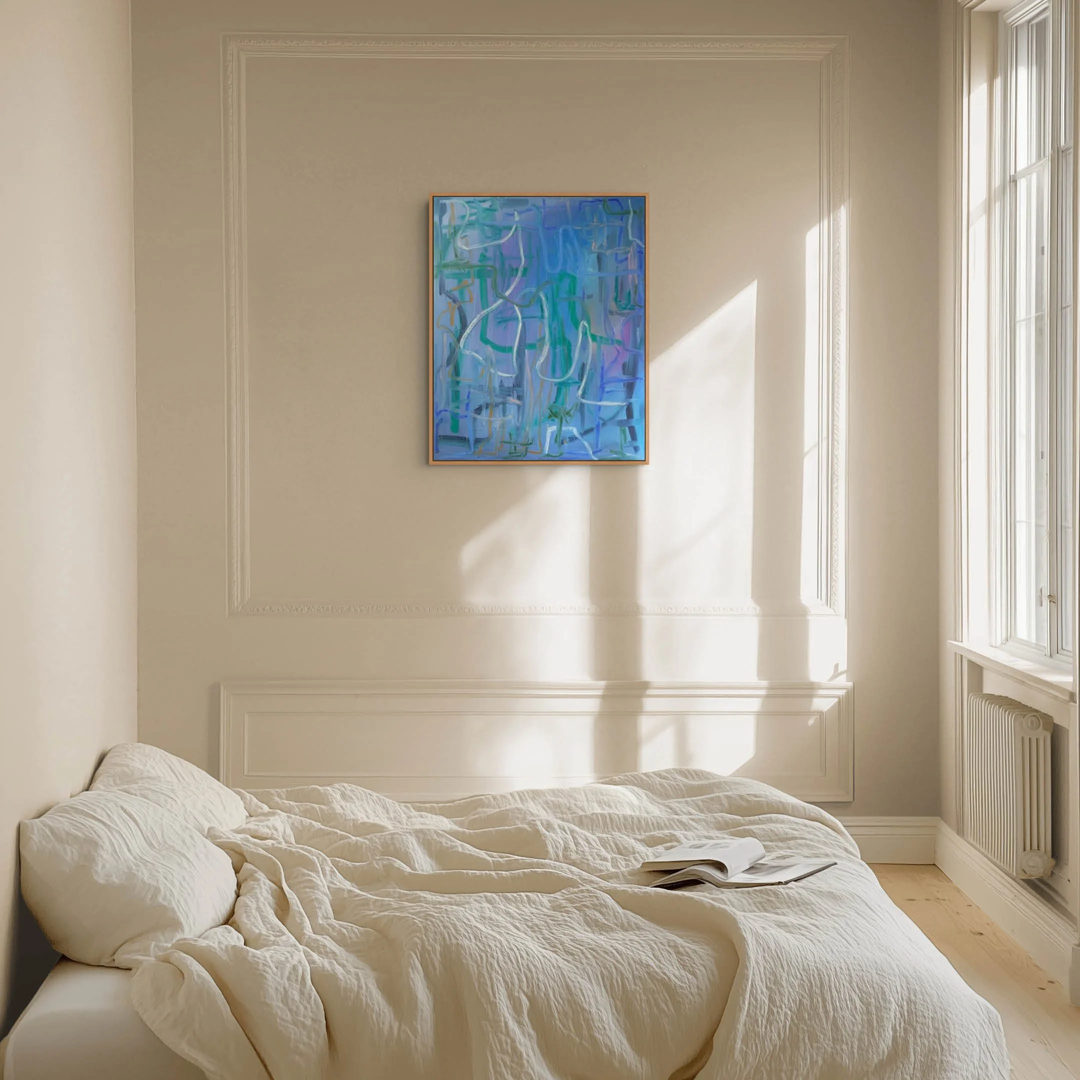 A bedroom with cream-colored walls, a window with natural light, a bed with a white quilt, and a colorful abstract painting on the wall.